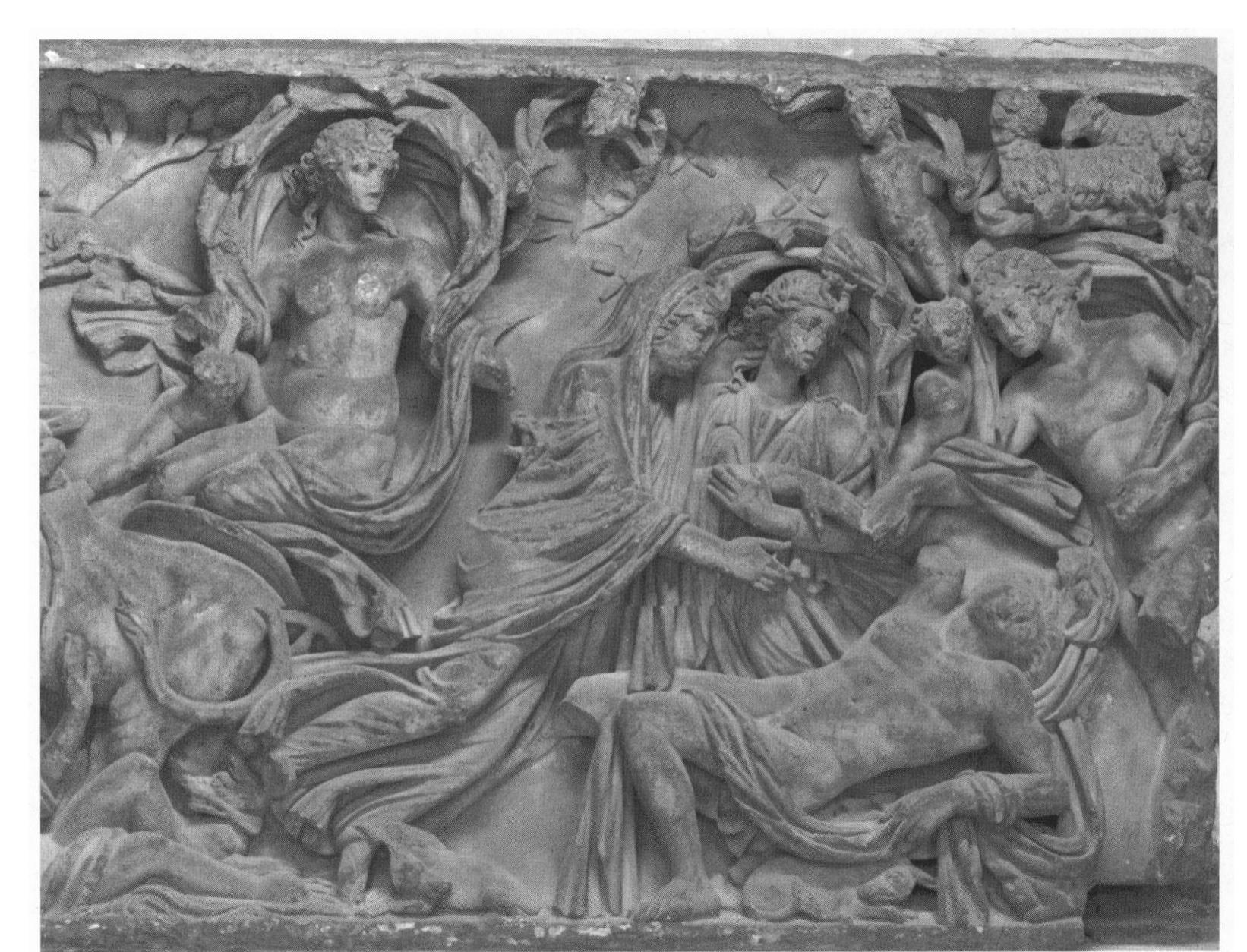 Figure 2. Encounter of Selene and Endymion on a sarcophagus, early third century c.e. Selene, tightly wrapped in her mantle, accompanied by Nyx and a number of Erotes, hovers toward the naked Endymion. San Paolo fuori le Mura, Rome. Photo: Inst. Neg. Rom 1976.0989 (Rossa). 