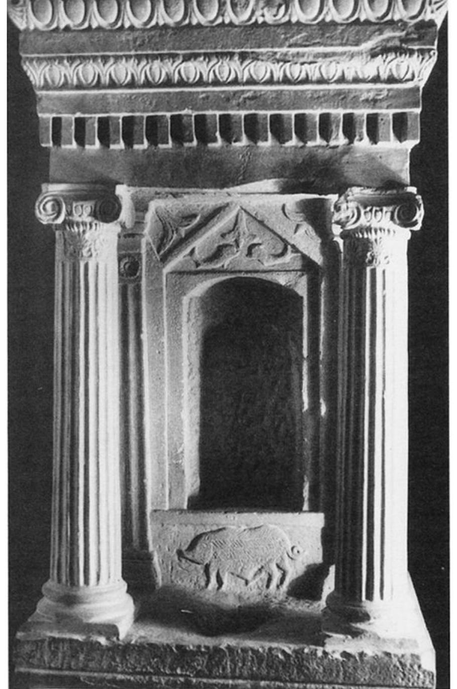 Fig. 20. Temple model from Thuburbo Maius. Tunis, Bardo Museum. (Courtesy Musée National du Bardo)  rebuilt during the Roman period contain inscriptions mentioning both Ceres and Tanit, and the votive finds from this sanctuary indicate an assimilation of these two divinities.?°° I therefore identify the central figure of the relief as Demeter/Ceres/Tanit. 