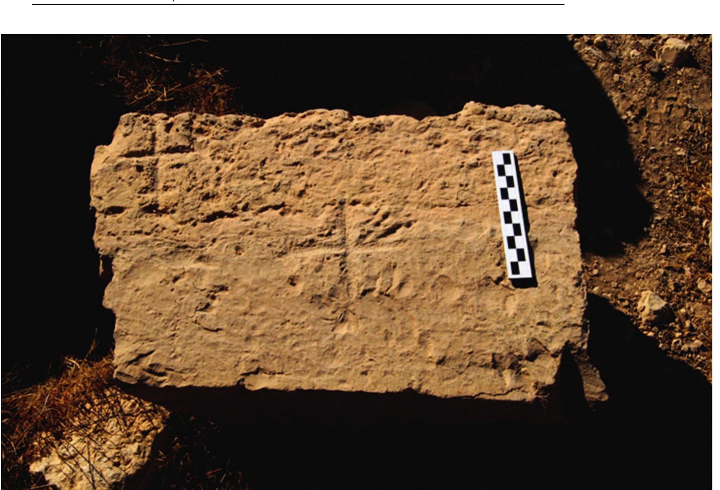 Fig. 8. Flat stone slab — possible altar table — with two crosses (photo by P Nocun)  Ifindeed Qasr ed-Deir was a Byz-  er. The name given to the site indicates 