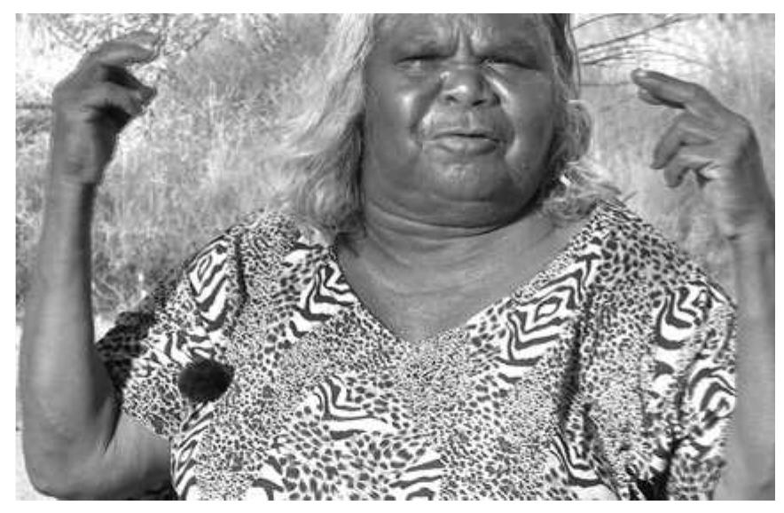 Figure 15: Two-handed version of Loox sign?°  Reciprocity is expressed in spoken Ngaanyatjarra by suffixing a reciprocal pronoun to the end of the first word in the phrase. At least for some signed verbs reciprocity can be expressed by articulating the sign on both hands and directing the signs in space in meaningful ways. The sign LOOK/SEE is an example of this, and in both the NCD and in the Western Desert this sign is formed with the first and second fingers extended in a loose ‘V’ shape (see also Figures 6 and 7). In Figure 15 the signer begins a 