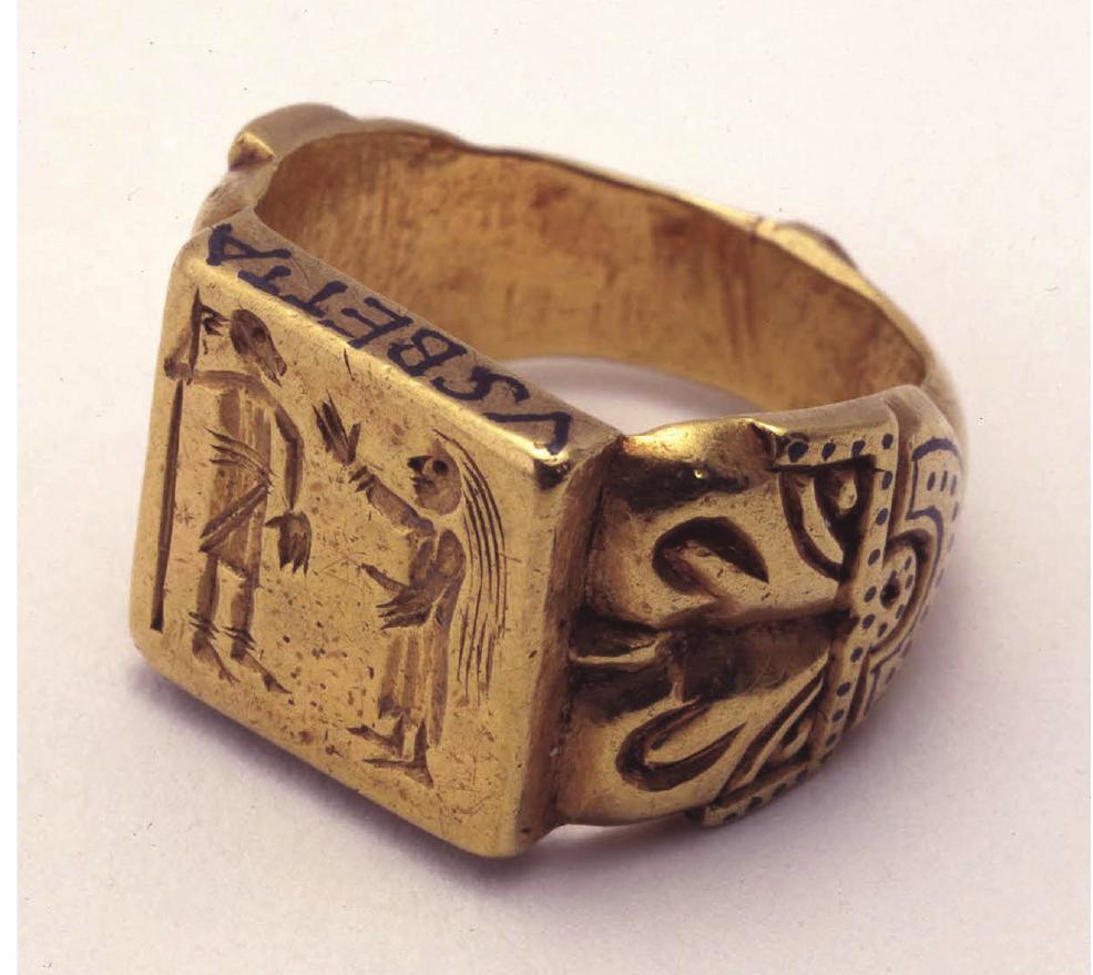 Figure 7. Gold signet ring from Mulsanne, France. (Courtesy of the Trustees of the British Museum.)  Figure 6. Conjoined animal heads/facemask on th shoulder of the northwest Essex ring (above the bezel). (Courtesy of Chris Fern.) 