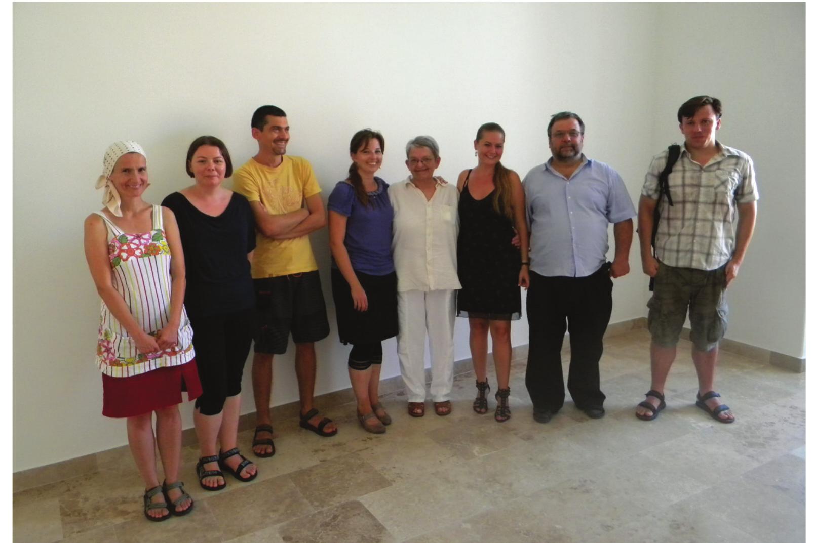 Fig. 1. Group photo of the team on the end of the first, introductory meeting, 24.08.2012. (From left to right: Katalin Gherdan, Ildiké Katalin Pap, Tibor Akos Racz, Szabina Merva, Maria Toth, Monika Mészaros, Miklos Takacs, Zsolt Petkes) (Photo: Gergely Csiky)  of the analysed excavations, and a good part of the members of our group had studied the possible impact of the chronology on the inner structure of village-like settlements too. 