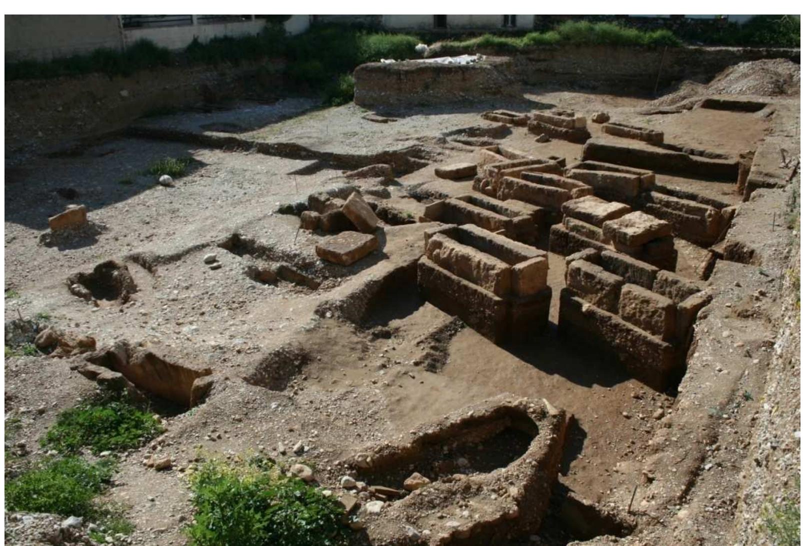 FIG.2 A late Classical burial cluster NE of Argos. (Photo: Nikolaos Dimakis)  The pattern seems to have been modified, in the early Hellenistic period or just before. Shortage of space as the result of marked population growth led people to place their dead wherever there was available space.“ Hellenistic graves are found on the outskirts of Classical or even earlier burial grounds or are cut into them.'® This more individualized way of placing the dead in the Hellenistic period was probably also related to the individual's wealth. Monumental tombs containing multiple wealthy burials were increasingly erected along roads during this period.'’* They were thus visible 