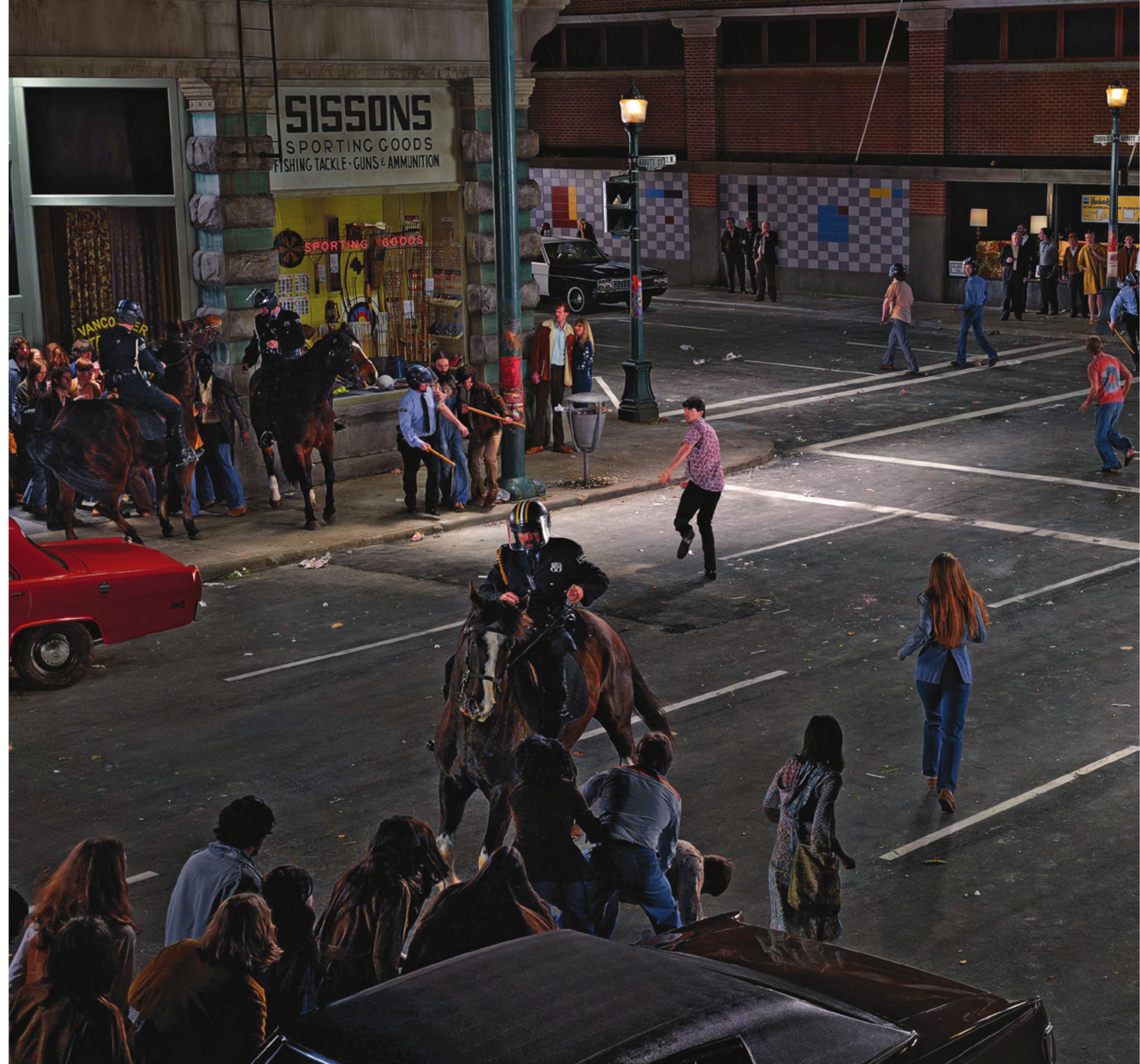 festival,” youth congregated on the square to openly smoke pot (it was described as a “smoke-in”), to play music and to generally assert their presence and right to gather in public space.  should be considered in relations to the broader context of anti- war and civil-rights demonstrations of the 60s. In fact, the Sis- sons Sporting Goods store seen in the back left street corner is a faithful duplication of the storefront that existed on that corner in 1968, and an archival image of it dated 1968 is included in the catalogue that accompanies Douglas’ artwork.'¢ As this suggests, Douglas’ photograph was not taken on the original site, but was created on a movie set made in a parking lot, which comprised an artificial street, flats for the two buildings seen in the shot, “700,000 watts of tungsten light” and performers cast from more than one thousand hopefuls.!” The photo is also many photos: 50 single digital images were used to create the final single image.  A key component of the subject matter of Abbott & Cordova, 7 August, 1971 (2008) is Douglas’ conscious decision to create a rep- resentation of the historical conflict one block away from where it actually began. As Alexander Alberro summarizes it, “the cornet... that the mural depicts is on the margins of the epicentre of the event.’!5 Douglas explains that in the context of contemporary global political demonstrations—this interview was conducted before the Arab Spring and Occupy Wall Street movements of 2011—the “smoke-in” of 1971 may seem relatively frivolous, but 