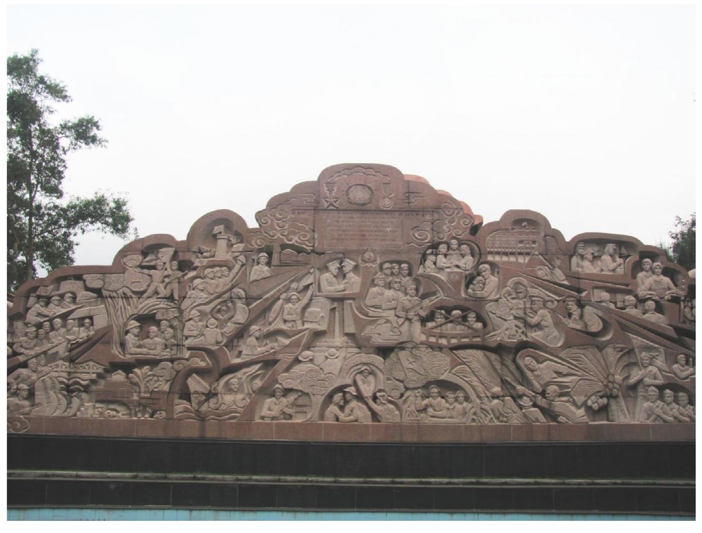 These ‘six things Uncle H6 has taught the People’s Public Security’ (6 diéu Bac Hé day Céng an nhan dan) have become an integral part of the revolutionary tradition of the Vietnamese security apparatus and are constantly repeated at meetings, not just on monuments.?! The virtues propagated by Hé Chi Minh are more comprehensive than the Chekist virtues, since they not only include the moral aspect of the personality of the security cadre, namely his incorruptibility, but also his absolute allegiance to the socialist government and resoluteness in the face of the enemy. The two halves of the relief depict the contributions of the security forces to the fight for the liberation and reunification of the country, for socialism, and against ‘the enemies of the revolution’ Inscriptions and pictures in the right and left half illustrate various stages and turning-points in the struggle of the People’s Public Security Forces in the North and the South, respectively — both master narratives merge in the centre of the relief and culminate in the victorious end of the Second Vietnam War in 1975 and the reunification of the country in 1976.