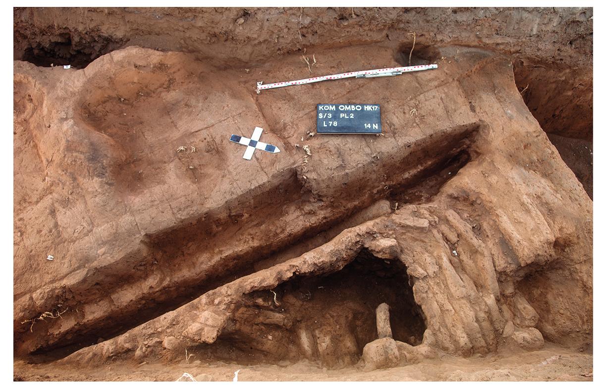 Remains of an older burial — a scatter of small human bones and a pelvis — were alsc found, showing that the chamber was re-used. 