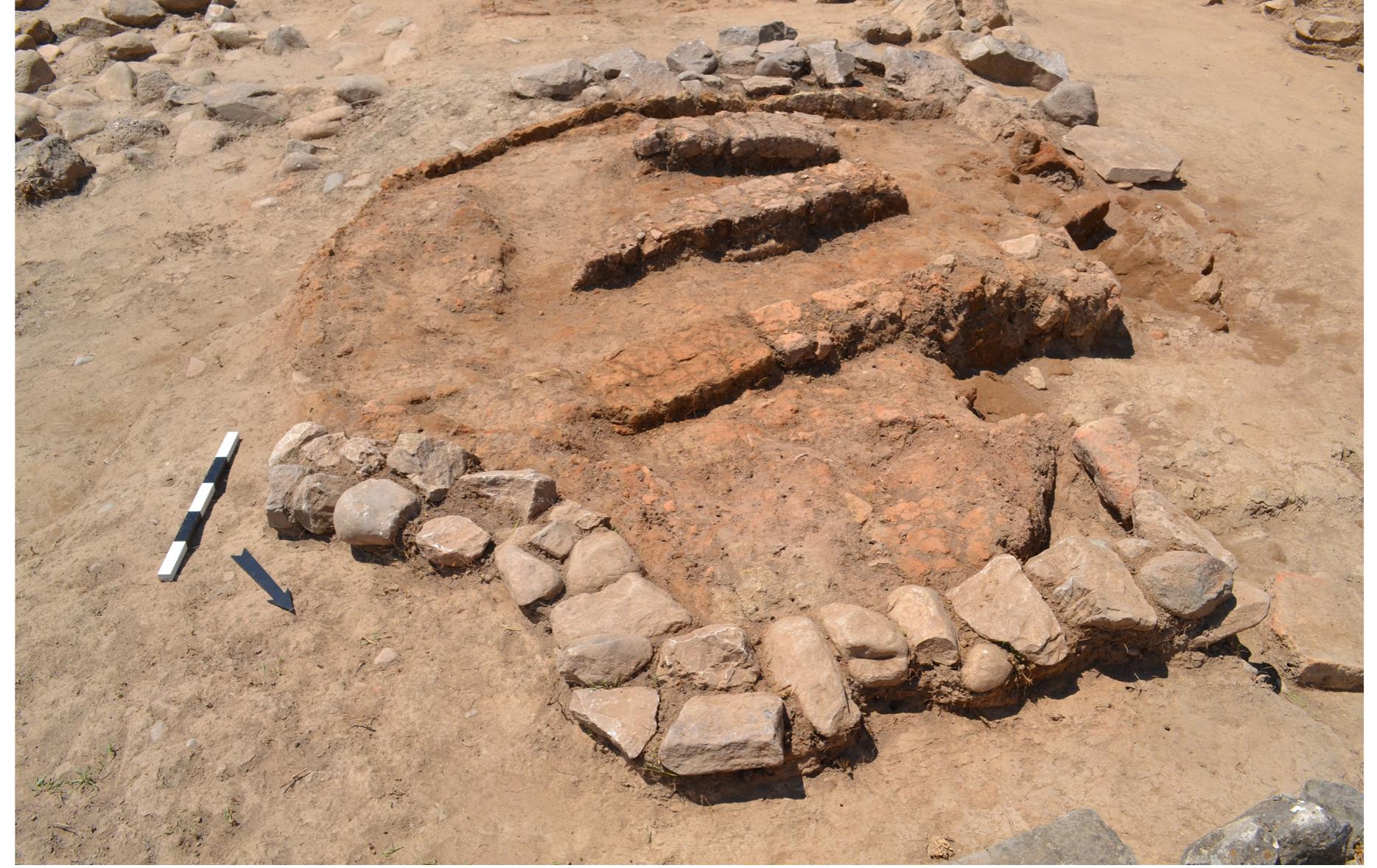 Fig. 9. Kiln 1 at the start of the excavation. A row of stones is visible on the northeastern part of the kiln.
