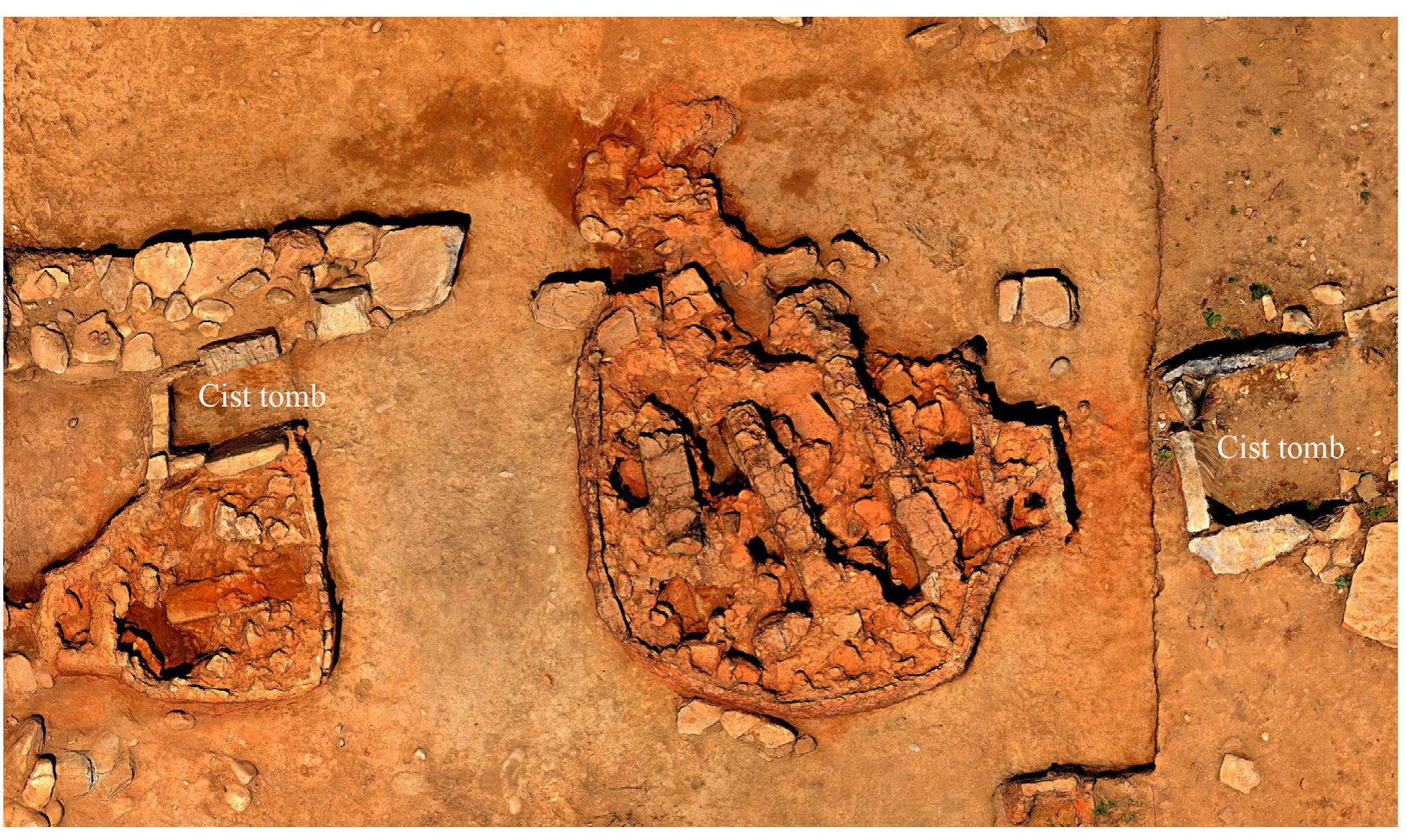 Fig. 16. Trench 008 showing the two kilns (with destruction debris still inside them) and two cist tombs.
