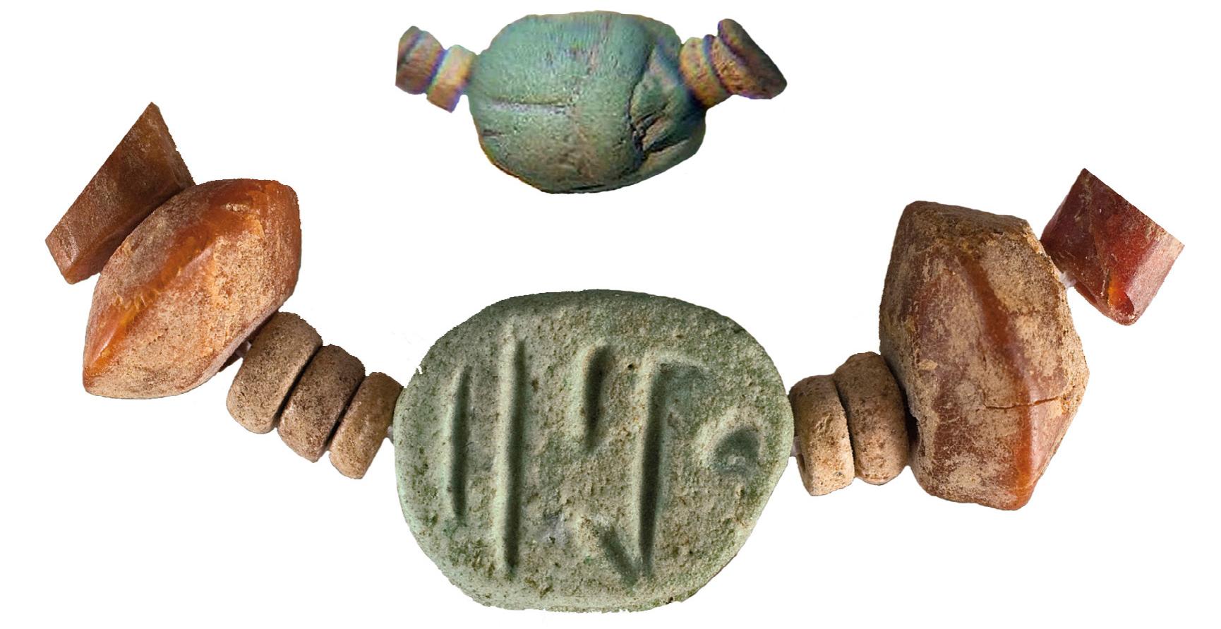 Fig. 14. Egyptian scarab and amber beads from Lyubcha (after magazine “8”, cover page)

