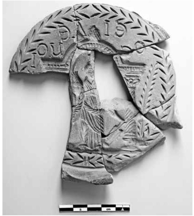 Fig. 13 Terracotta mould for plaques representing the Tychaion 