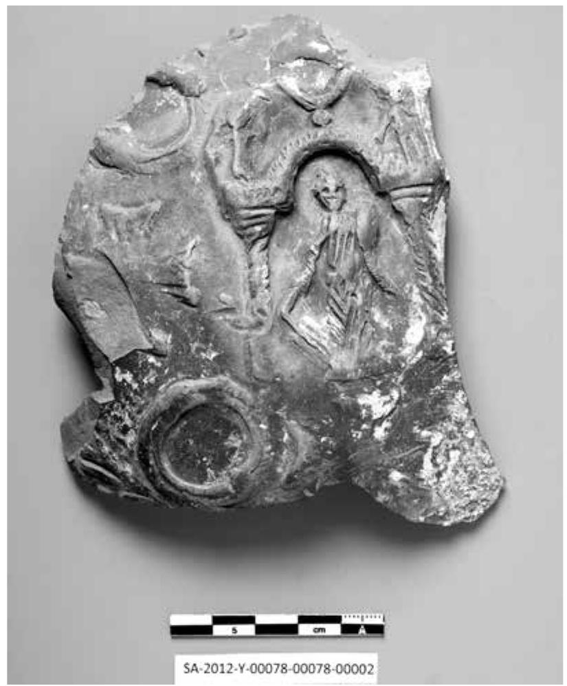Fig. 23. Sherd of a relief decorated oinophoros depict- ing the Tychaion 