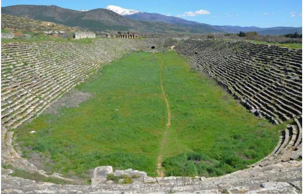 The Stadium of Aphrodisias, Caria. The well preserved stadium located in the northern end of Aphrodisias, is 262 m long and 59 m wide with 22 rows of seats, offering seating for 30.000 spectators. Image courtesy of www.aphrodisias.com 