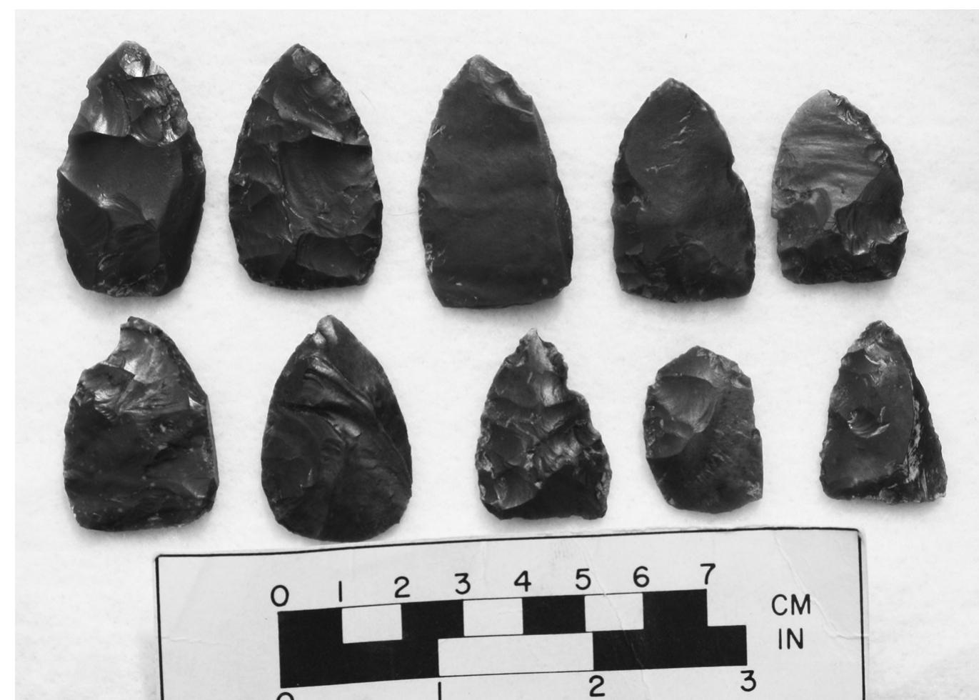 of this piece is quite abrasive and would have worked well as that type of tool. ‘The vast majority of the artifacts recovered as part of the cache (40 of 43 total pieces) were made of red Hartville Uplift dendritic chert from the Hart- ville quarry, which is located in Platte County in southeastern Wyoming. Sev- eral of these pieces bleed into a tannish-brown, but the texture of the material is consistent throughout the assemblage. Hartville Uplift chert is related to other Mississippian age dendritic cherts from Montana and Wyoming and is frequently recovered in an archaeological context far from its geological origin. The North Platte River contains many large cobbles of Hartville Uplift chert, and unmodified cobbles can be found in the river gravels well into Nebraska. Of the artifacts in the Westfall portion of the cache, all but three were  Utd eee Wei 111A VIET £tailvilivl Me MARTIN LEILTE AEE LUIS LAL” ville quarry, which is located in Platte County in southeastern Wyoming. Sev- eral of these pieces bleed into a tannish-brown, but the texture of the material is consistent throughout the assemblage. Hartville Uplift chert is related to other Mississippian age dendritic cherts from Montana and Wyoming and is frequently recovered in an archaeological context far from its geological origin. The North Platte River contains many large cobbles of Hartville Uplift chert, and unmodified cobbles can be found in the river gravels well into Nebraska. Of the artifacts in the Westfall portion of the cache, all but three were made of Hartville Uplift jasper. One flake (#29) was made of Black Forest (Eliz- abethan) wood, one was made of a local tan quartzite (#30), and one piece is made of silicified sandstone (as discussed above). Their presence in the cache seems somewhat out of place; however, the quartzite piece appears to be a bro- ken preform similar in shape to the other preforms recovered, suggesting it is indeed part of the cache. The piece of Elizabethan wood appears to be a flake that was driven from a large core. It doesn’t appear to have any remaining functionality, though it is pointed on one end and could have been utilized as a punch if necessary. Considering the amount of Elizabethan wood that is pres- ent in the area, it is possible that this particular piece is intrusive and does not 