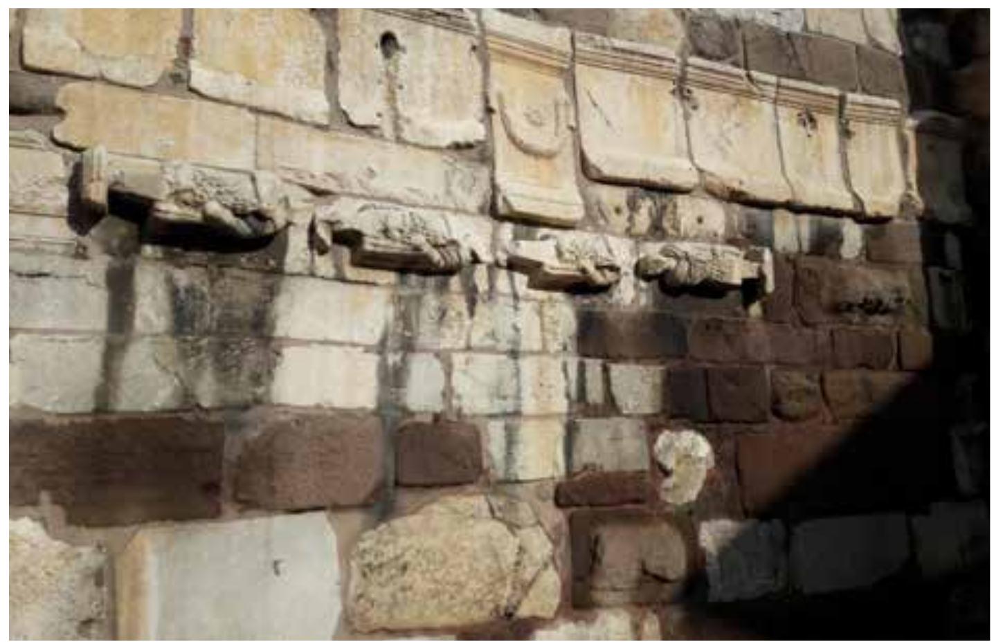 Finally, the Plan requires the destruction of se- veral buildings and structures which became pro- minent in the economic and social life of Ankara citizens and replace them with touristic, first-class restaurants and shops, which redefine the identity  Reuse of roman decorated parts. Sculptures and inscriptions are used to reconstruct the Medieval architecture. 