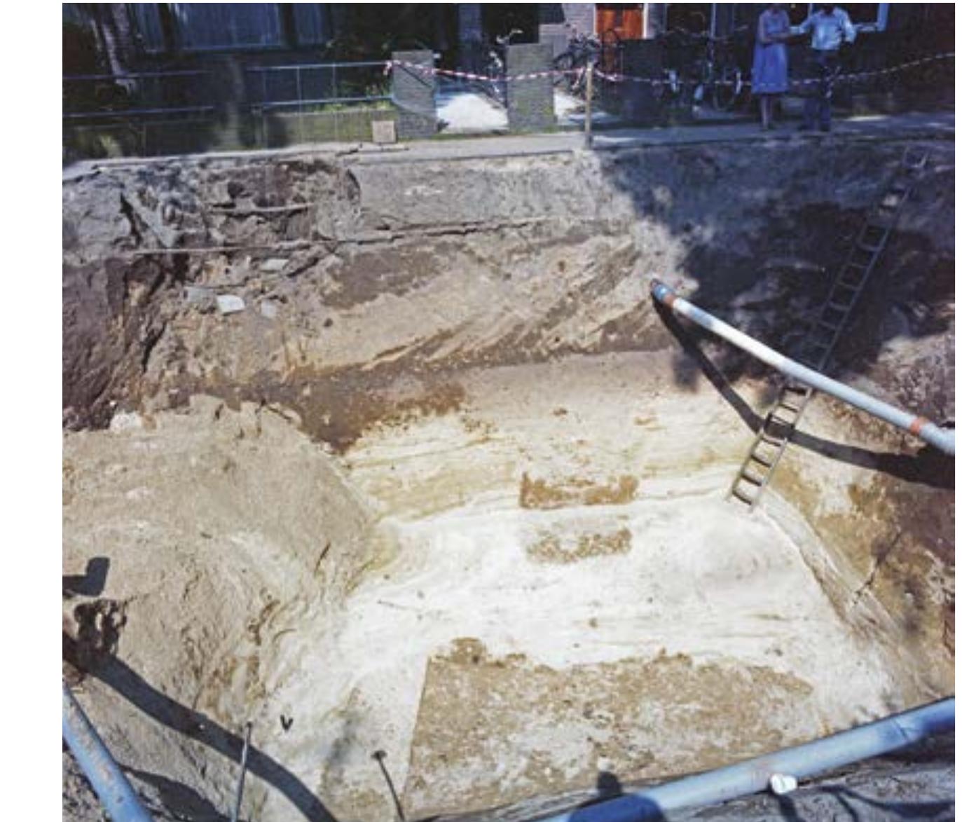 Fig. 9 Nijmegen. Amphitheatre: cellar and tunnel; view from the east (photo: S. Kuppens, ROB).  Fig. 10 continued Nijmegen. Amphitheatre: southern arena entrance. Trench 137: d. East-west profile, north section (Drawing 1116); e. Trench 132: West profile across the two eastern post alignments (Drawing 1094). Scale 1: 100. 