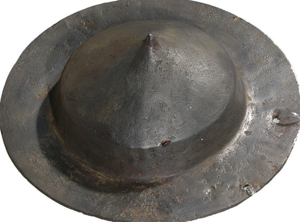 A second find is interesting in that it can be linked to Germanic people serving in the Roman auxilia. The fragment is decorated with V-shaped lines and crosses in a style that is considered to be of Germanic origin (fig. 36.1).'° The fragment cannot be dated by its context, as it is a stray find, but according to Weif-K6nig  Germanic shield fittings were replaced by Roman ones in the 2nd century at the latest.!°! 