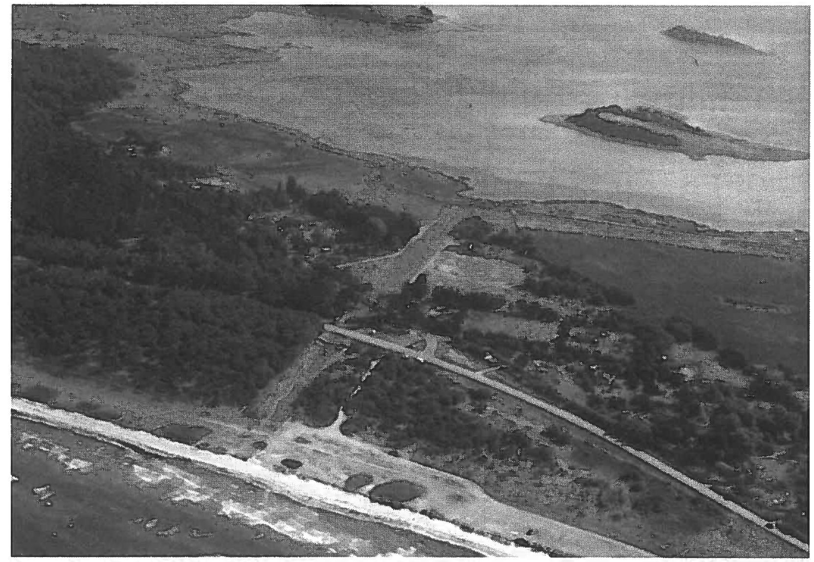 Fig. 7. — Aerial photo of the Kanhave Canal. At the bottom of the picture traces are visible of the first of the excavations in 1995 (the light sand area at the west end of the canal), and at the top the second excavation of the year can be seen in process. Photo Lars Jgrgensen. 