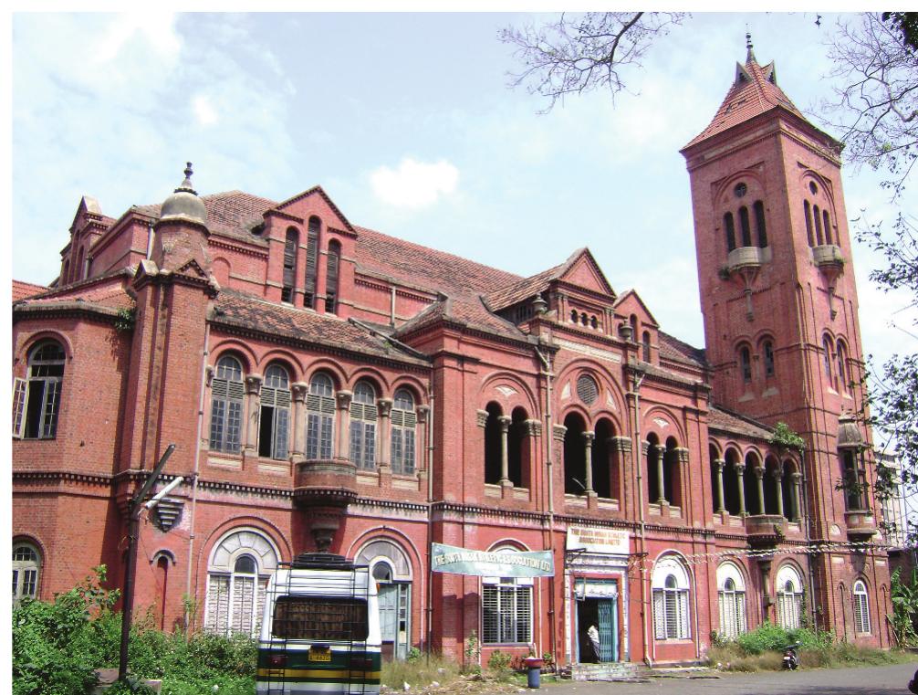 Figure 5. Victoria Public Hall. Courtesy of Wikimedia Commons.  was also prescribed, guaranteeing propriety. The most expensive seats cost Rs. 2 (sofa accommoda tion); access to the separate gallery for ‘Hindu females’ was only six annas.”*°  In short, by the early decades of the 20th century, Tamil musical drama, circulating through : professionalized company system, displayed various aspects of Parsi style and practice. Loca companies at times adapted the nomenclature, tale types, and melodic forms of Parsi theatre while emulating troupe formation and structural properties of the proscenium stage. Tami dramatists advertised their linkage to the imported art, adding ‘Parsi’ as a label to identify titles songs, even actors. There is evidence to argue that isai natakam became a composite form, that ; ‘Parsi-Tamil’ synthesis of sorts occurred. This appears to be the case in the acceptance of harmo nium and tabla as the quintessential natakam orchestra. But the extent and duration of Pars influence cannot really be evaluated without more thorough study. What this review does mak clear is that playwrights, publishers, performers, and playgoers perceived ‘Parsi-ness’ in a desirabl light and sought to connect their evolving project to it. How Parsi theatre came to acquire thi positive aura is the concern of the next two sections, in which details of the history of Parsi troupe in Madras is presented. 