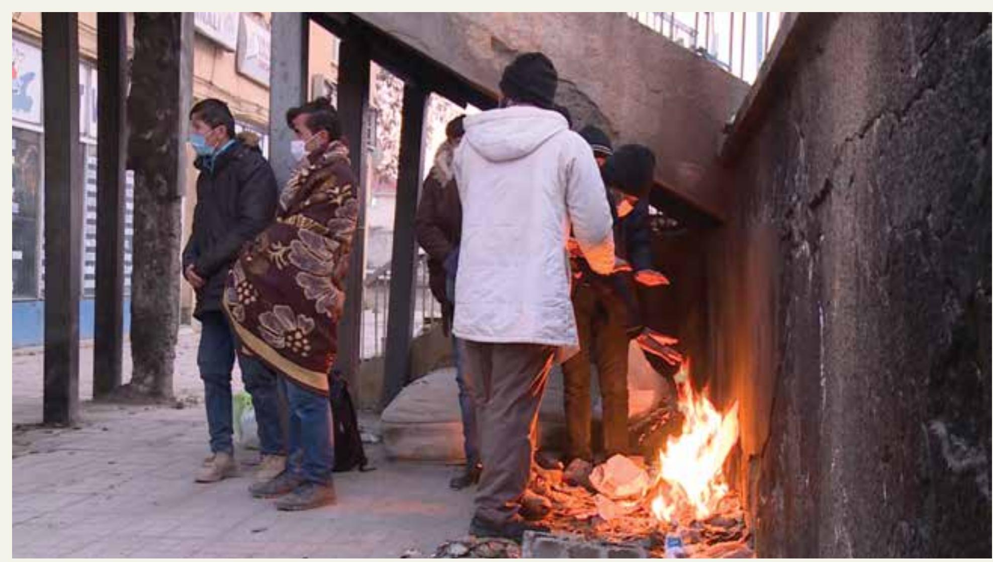 Figure 6: A group of Afghans who have just crossed the Turkish-Iranian border. They arrived Van after 40-days long journey, stayed ina “khabgah” for couple of days and then were abandoned. As they mentioned, there were people who died or severely injured during the journey in Iran. In the photo, they wait to find a way to spend the night and then move on. [Photo: Volkan Nakibodlu] Courtesy of Hale Goniiltas and Volkan Nakibodjlu, the author is thankful for their generous sharing. 