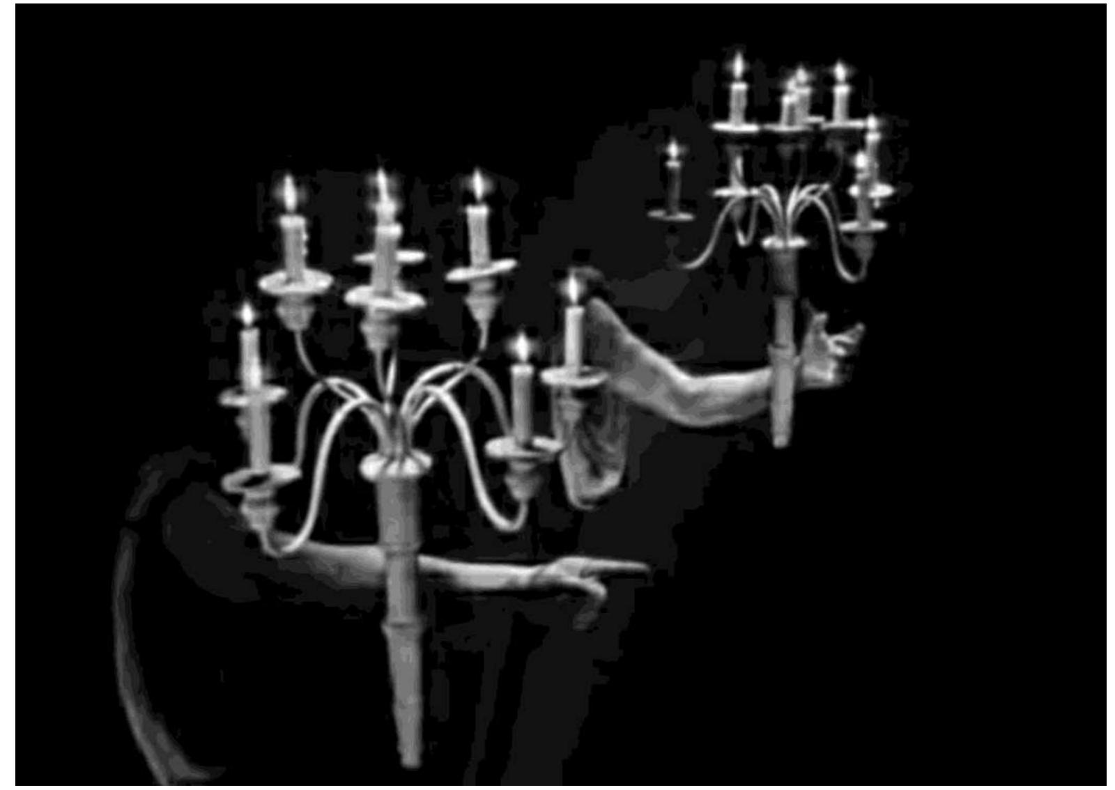 Figure 7 - Jean Cocteau, La Belle et la Béte, arm-shaped candle sticks, film still  in the power of Beauty to see The Beast as human, and not as an animal. 
