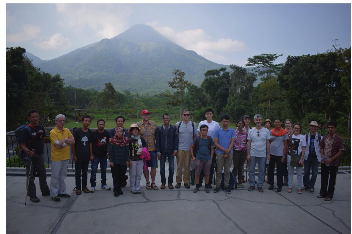 Fig. 1 — Most of the participants of the 3rd International Intensive Course in Old Javanese pose with Mount Penanggungan in the background, Trawas, 2017. 