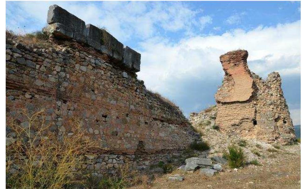 Figure 13 | A section of the remaining Byzantine fortifications in Nicaea. Carole Raddato/CC-BY-SA-2.0  but he was dissuaded by his generals. Encouraged by that, The Ottomans resumed their raids, virtually iso- lating the Emperor at Magnesia. Soon, the imperial army started dissolving without engaging ina single battle, that is because the local troops left to defend their homes which were continuously raided by the Ot- tomans, and the Alan mercenaries left as well, aiming to rejoin with their families in Thrace. The Byzantine emperor was forced to withdraw by the sea, followed by a wave of refugees. '48ll4sIl5°] To counter the threat to Nicomedia, Michael's father, Andronikos II, sent a Byz- antine force of some 2,000 men (half of whom were re- cently hired Alan mercenaries), under the megas he-  taireiarches, Giorgios Mouzalon, to cross aha. RACHAIC SHA Paltava thn cise [SSI 