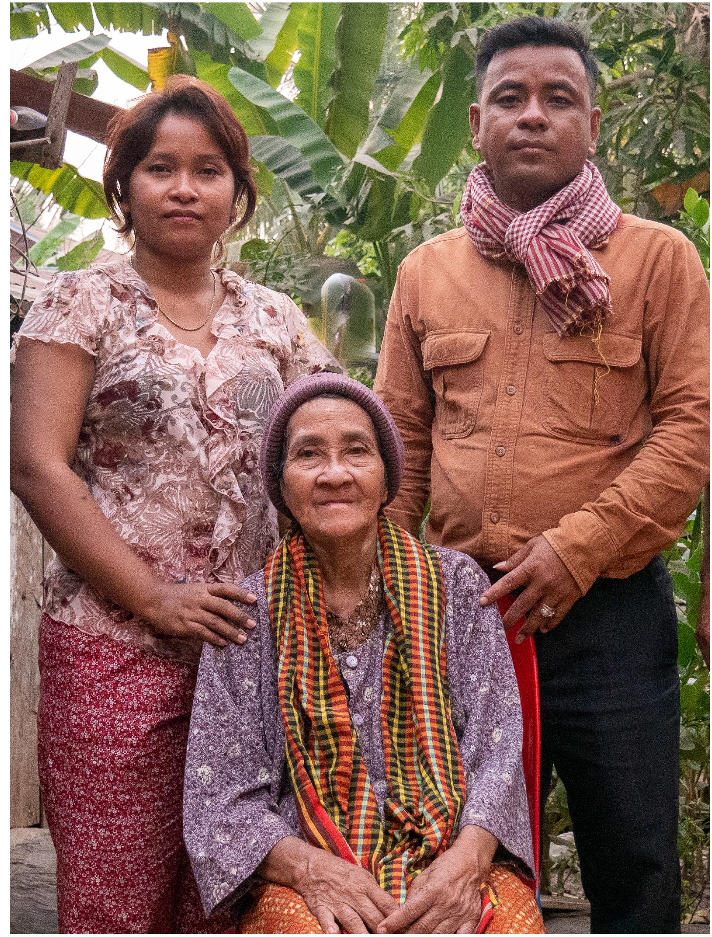 Figure 5: Siblings KOEUY Leakhena and KOEUY Reatha with their mother LAV Mech (seated), wife of angkuoch-maker MONG Koeuy. Photo: Catherine Grant, 17 January 2020. 