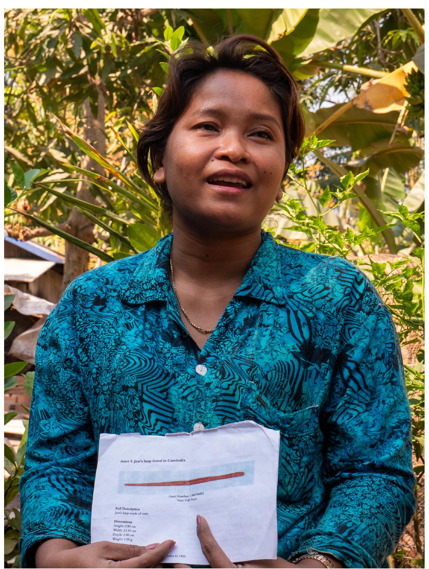 Figure 6: KOEUY Leakhena with a copy of the British Museum catalogue entry for the angkuoch russey in its collection. 