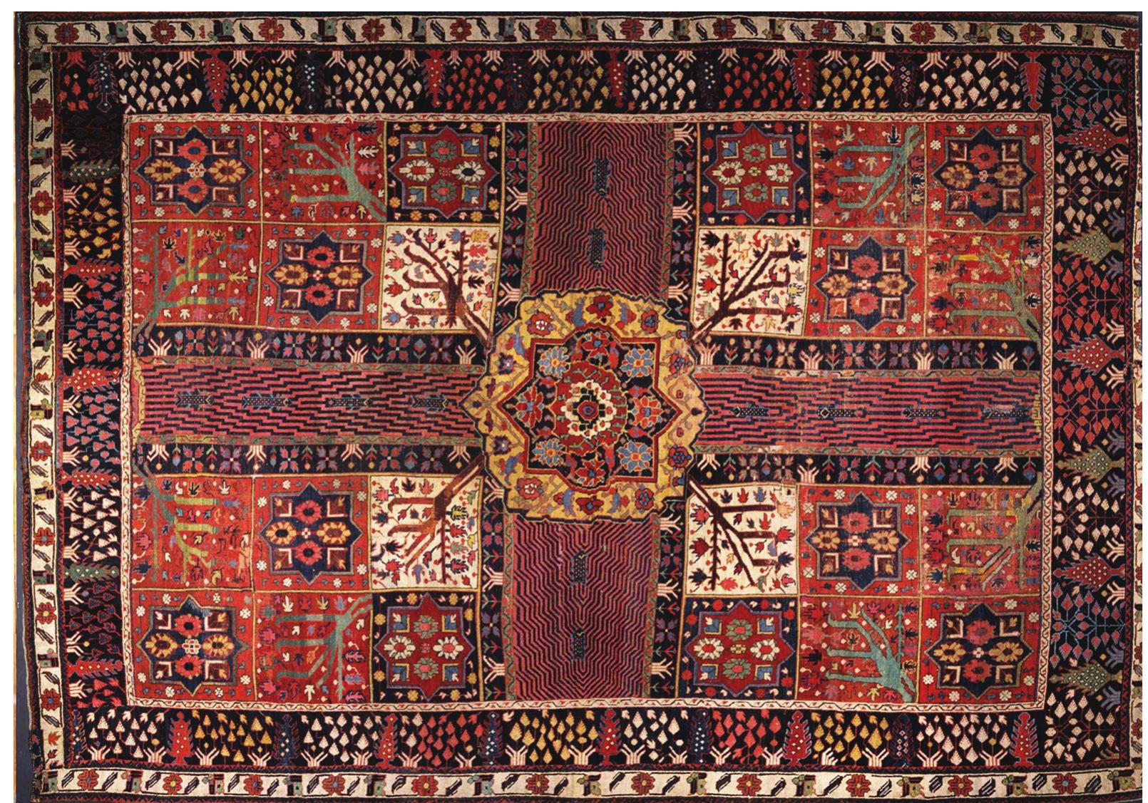 Figure 6. The ‘Garden’ carpet, eighteenth century. Courtesy: Victorian and Albert Museum, London, cat. no. T.10-1924  This design is a bird’s eye view, or a map, of a classical Persian garden divided into four beds by two intersecting channels of water. The garden is actually depicted from two points of view at once: from above, giving the architectural plan, and from the side, showing the trees and shrubs in profile. 