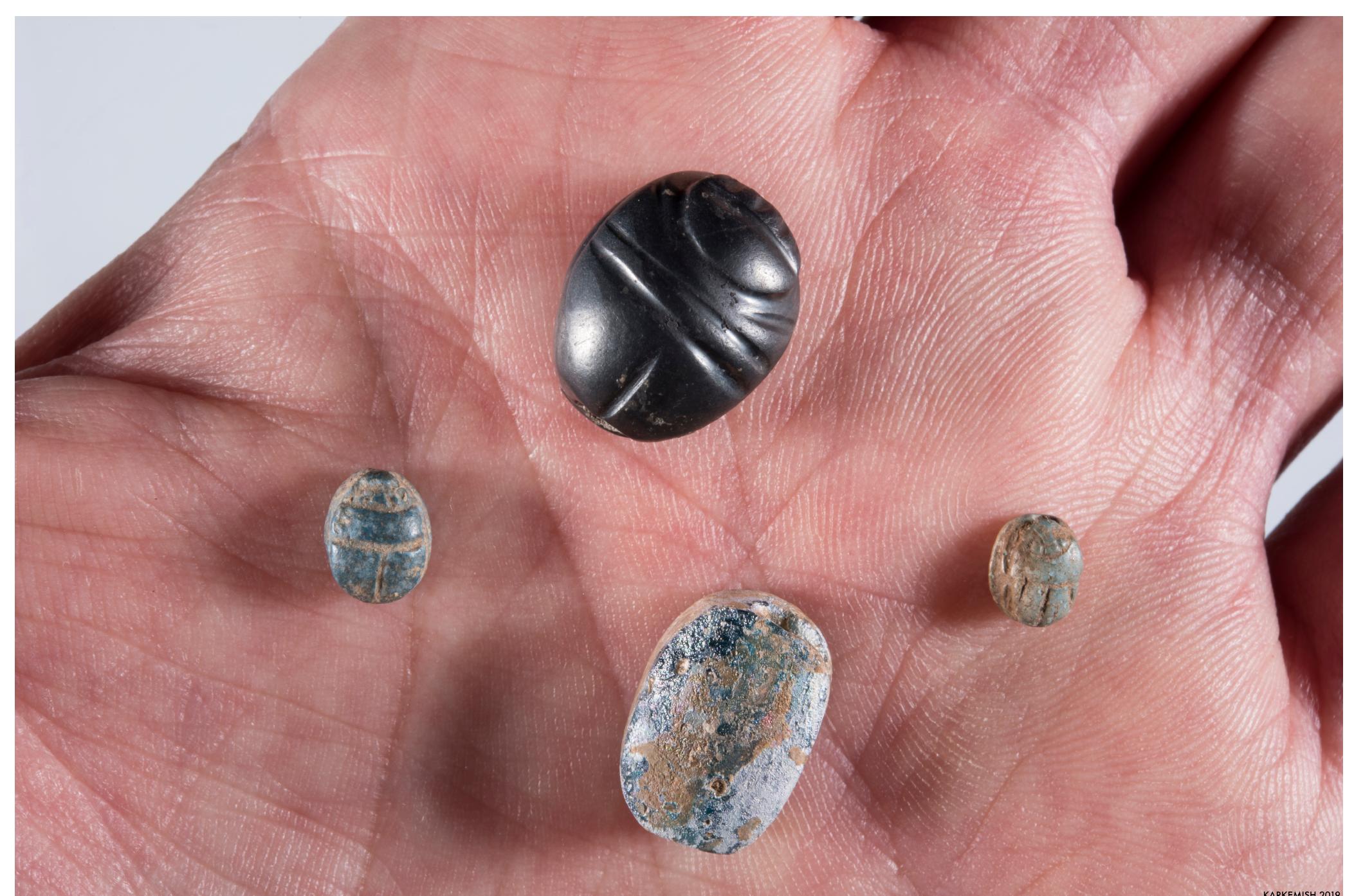 Fig. 9.21. Different types of scarab seals from an Iron HI cremation urn at Yunus (G.9977) 
