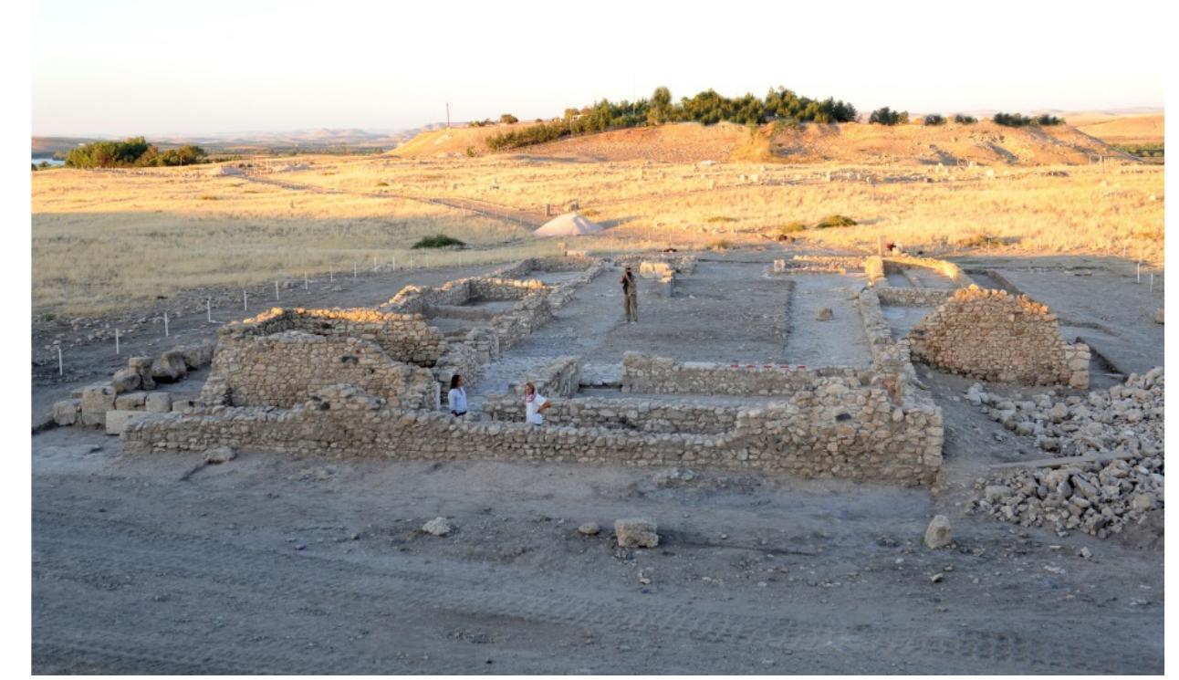 Fig. 13.2. The ruins of the British Museum dig house after our excavations, in background the acropolis.  Fig. 13.2. The ruins of the British Museum dig house 