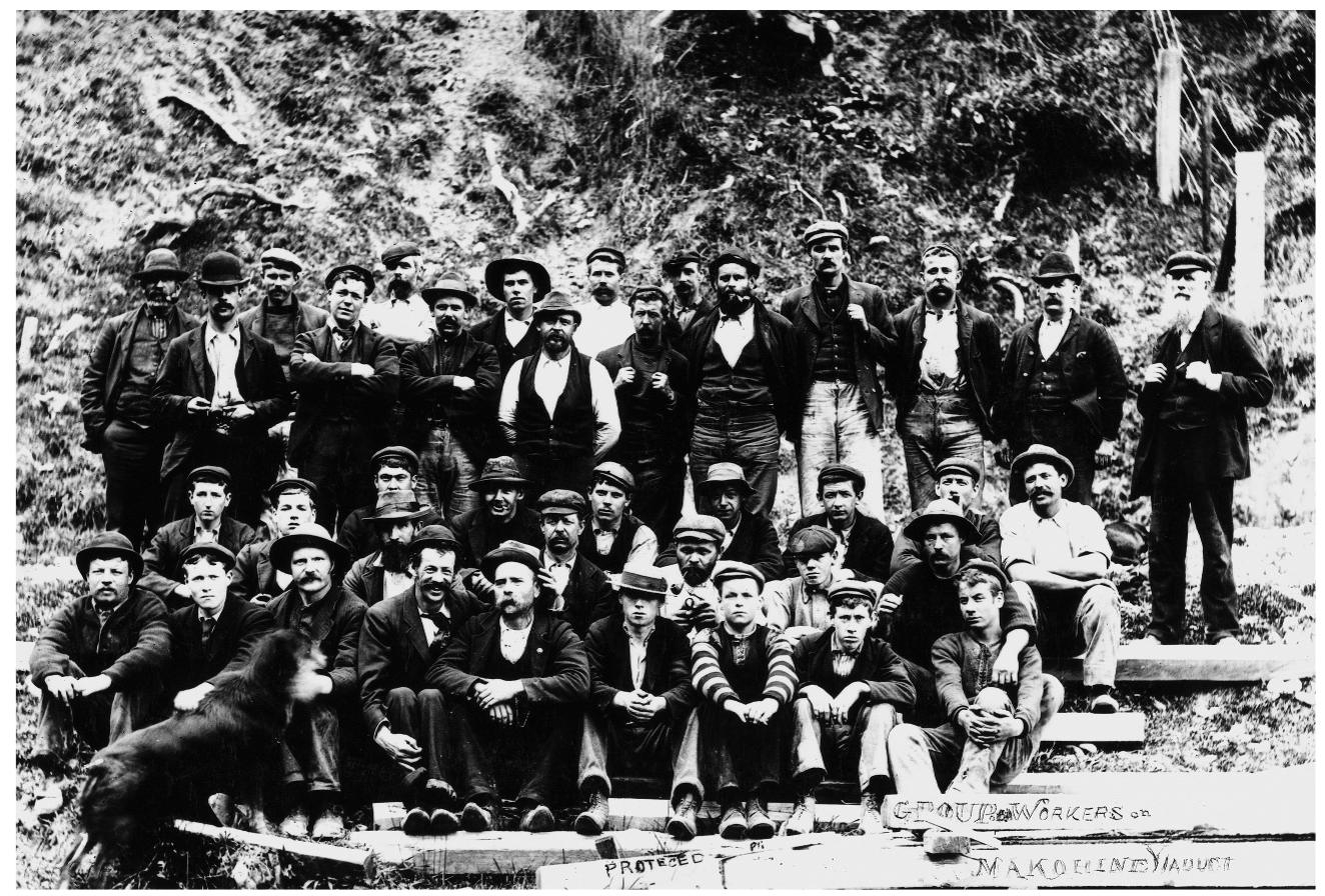 Figure 6. Makohine Viaduct workers. Ref: 1/2-094227-F. Alexander Turnbull Library, Wellington, New Zealand.  Ultimately, Lloyd’s belief that the cooperative system could be adapted tc mechanisation was ill-founded. Although the Public Works Departmen system continued until the 1940s, it always worked best for projects requir. ing manual labour and came to be understood chiefly as a method o unemployment relief. From the workers perspective, wages were low, anc life in cooperative work camps was difficult, not something many woulc choose to endure long term.*’ But for a brief period, New Zealand’s experi ment with labour cooperation on a steel-framed railway viaduct seemed tc point towards the realisation of a modern industrial democratic state.  The Makohine Viaduct and the NIMT received a great deal of attentior 