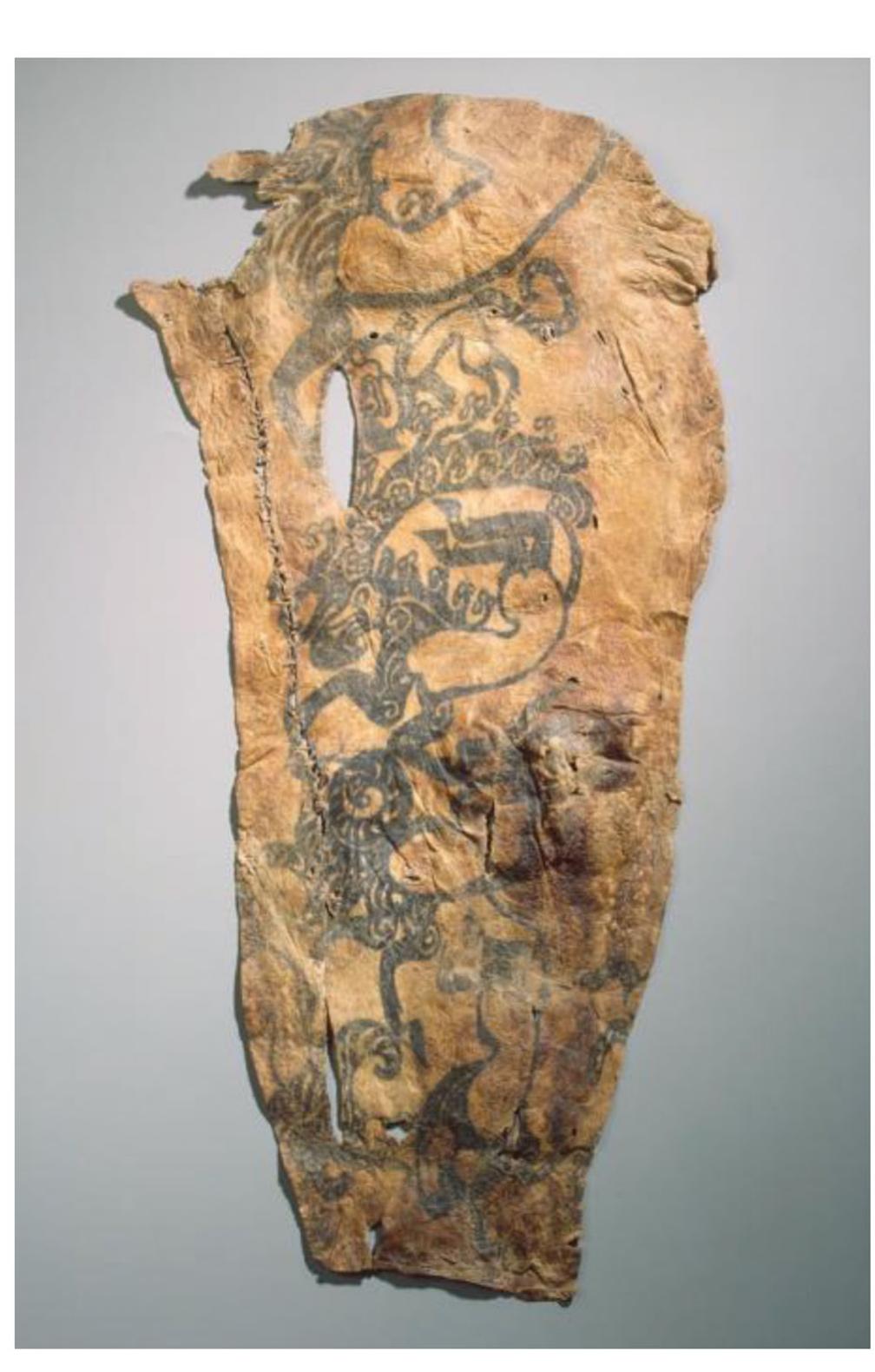 incongruities and biological impossibilities, in turn meant to uphold his status and divine agency during entombment.  The hybrids were meant to interact with the body they adorned and with each other: no image existed in a vacuum. This is how golden suits  >  came to be: these were not strictly “suits,” as we think of them today, but curated ensembles of hundreds or thousands of gold jewelry placed strategically across the body. The Aluchaideng is in fact among the modest examples of such ornamental suits—even more opulent ones  were excavated further west on the steppe. 