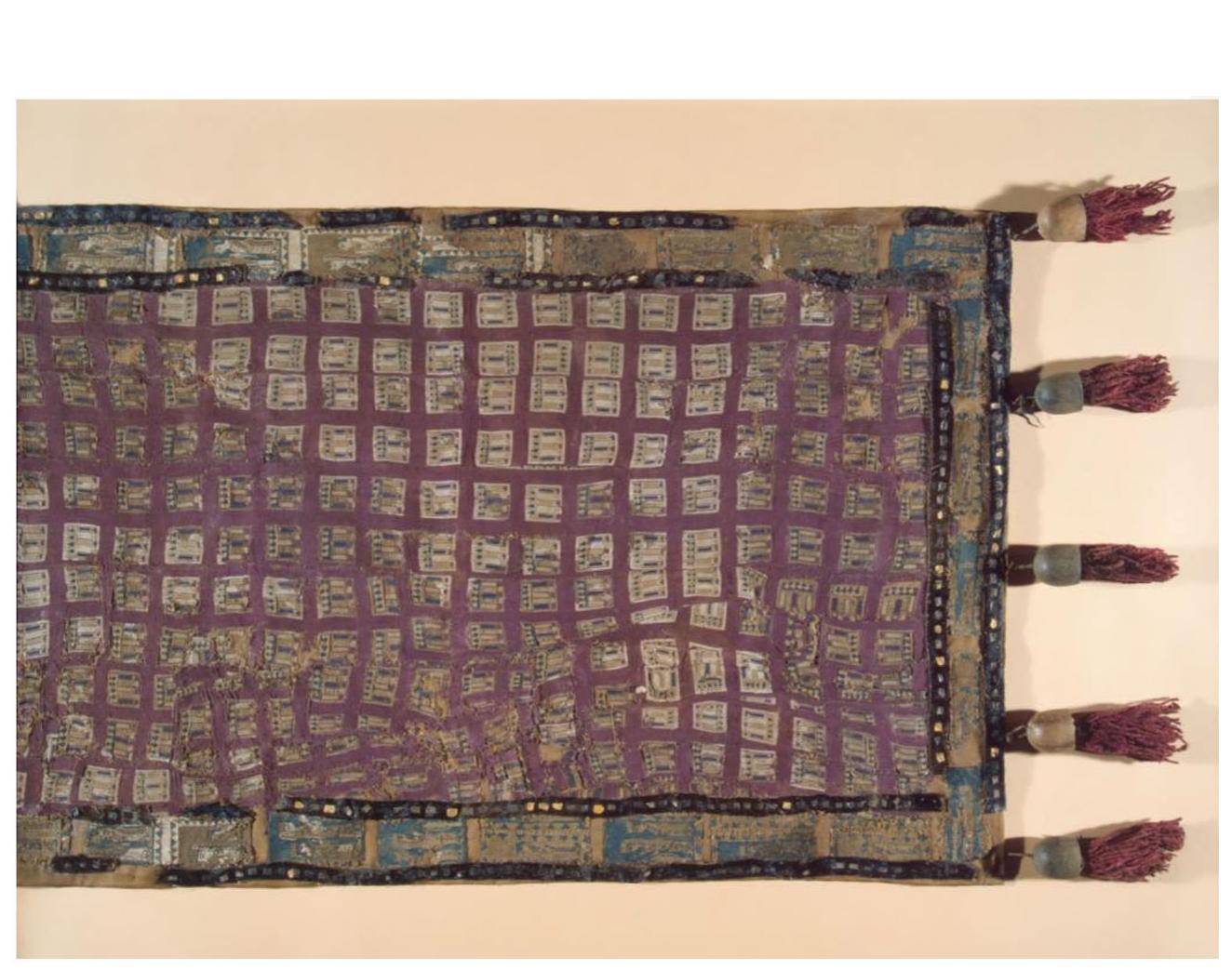 Figure 10  Pigure iv Iranian saddlecloth. Pazyryk. Felt, wool and gold foil. Image is used from www.hermitagemusum.org, courtesy of The State Hermitage Museum, St. Petersburg, Russia.  ERA L SWI OLAW VANS  A few of the textile interred at Pazyryk, however, are likely imports or local products made to resemble foreign ones. A case in point is the saddlecloth shown below, which came with a breastplate decorated with rows of lions (Figure 10). The borders feature processions of pairs of women holding their hands up in a likely gesture of prayer or vener- ation often required in supplication ceremonies. Rudenko suggests an Assyrian source for this image, drawing evidence from similar depictions of women in worship processions on bas-reliefs from the palace at Nineveh in Kuyunjik as well as on golden plaques from the Oxus treas- ure (Rudenko, 296). The cloth is devoid of animal forms; instead, the focus is placed exclusively on the female figures. The same saddlecloth also contains a chest strap showing a procession of lions. The strap had a felt base onto which the artisan would have sewn a tapestry band framed by geometric shapes. The lions are illustrated with their jaws wide open; their shoulders are marked by the “dot and comma pattern” often observed in animal images in Persian art. The image program here is no longer dominated by a zoomorphic repertoire—the focus shifts toward human images which is uncharacteristic of nomadic art. These textiles were likely obtained by the Pazyryk inhabitants through trade with West Asia. Even if they were in fact produced by local makers, 