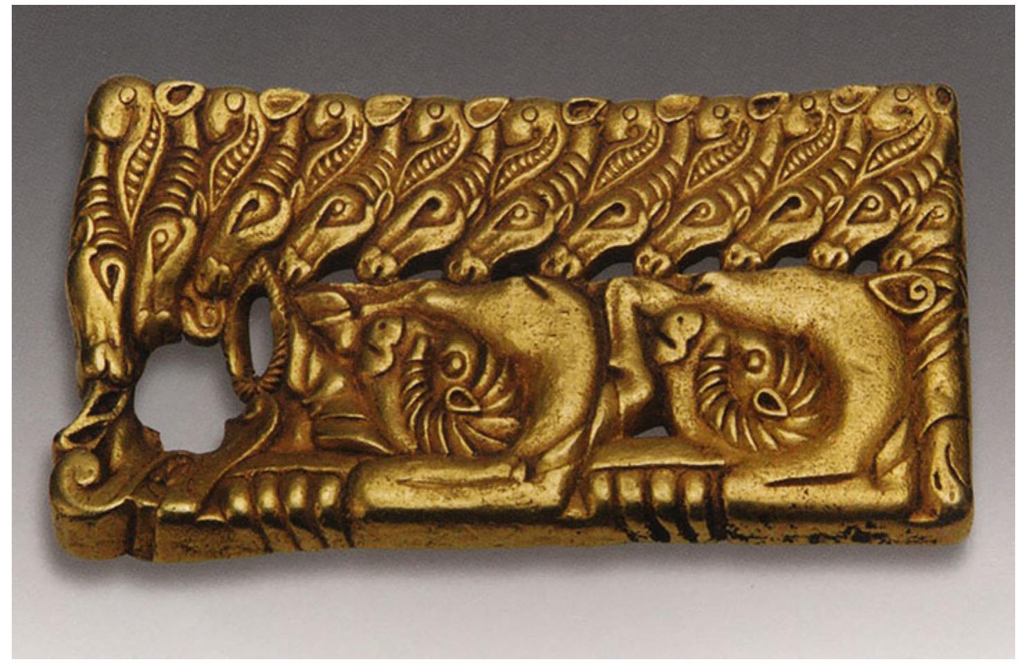 jst  Fig. 8. Belt buckle. Gold. Zhushanxian, Hubei province. 2nd century sce to 1** Century ce. 