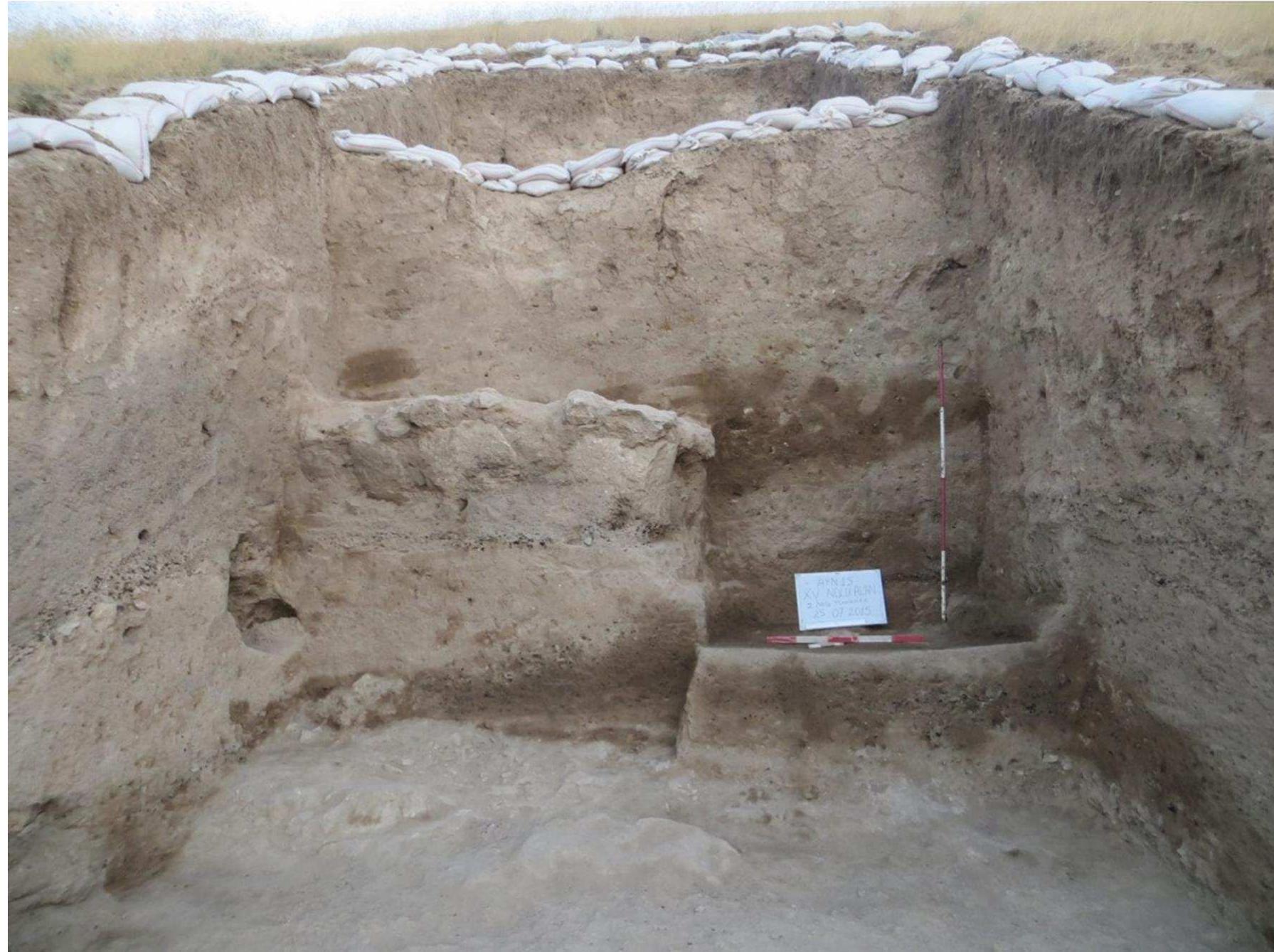 Fig.3.Remains of Trash Layer and Northern Fortification  The limited excavations carried out in the northern trench also allowed us to make new observations about the fortification wall along the northwest slope of the fortress. It was observed that the citadel walls were built of local limestone material and that the walls continued in two rows. The fortification wall is a continuation as material and technical planning of the eastern fortification walls of the fortress, of which were imprecisely built by partially processed limestones. With the remains of this wall, it was understood that the most of which were the animal bones “‘trashes”, were randomly thrown out of the outer fortification wall. The fact that the midden area is situated just outside the fortification wall indicates that the wastes or trashes are thrown out of the outer wall of the fortress. Considering the slope from top to bottom  of the waste layer uncovered here, it is understood that the garbages of the fortress are thrown out of the outer fortification wall.  