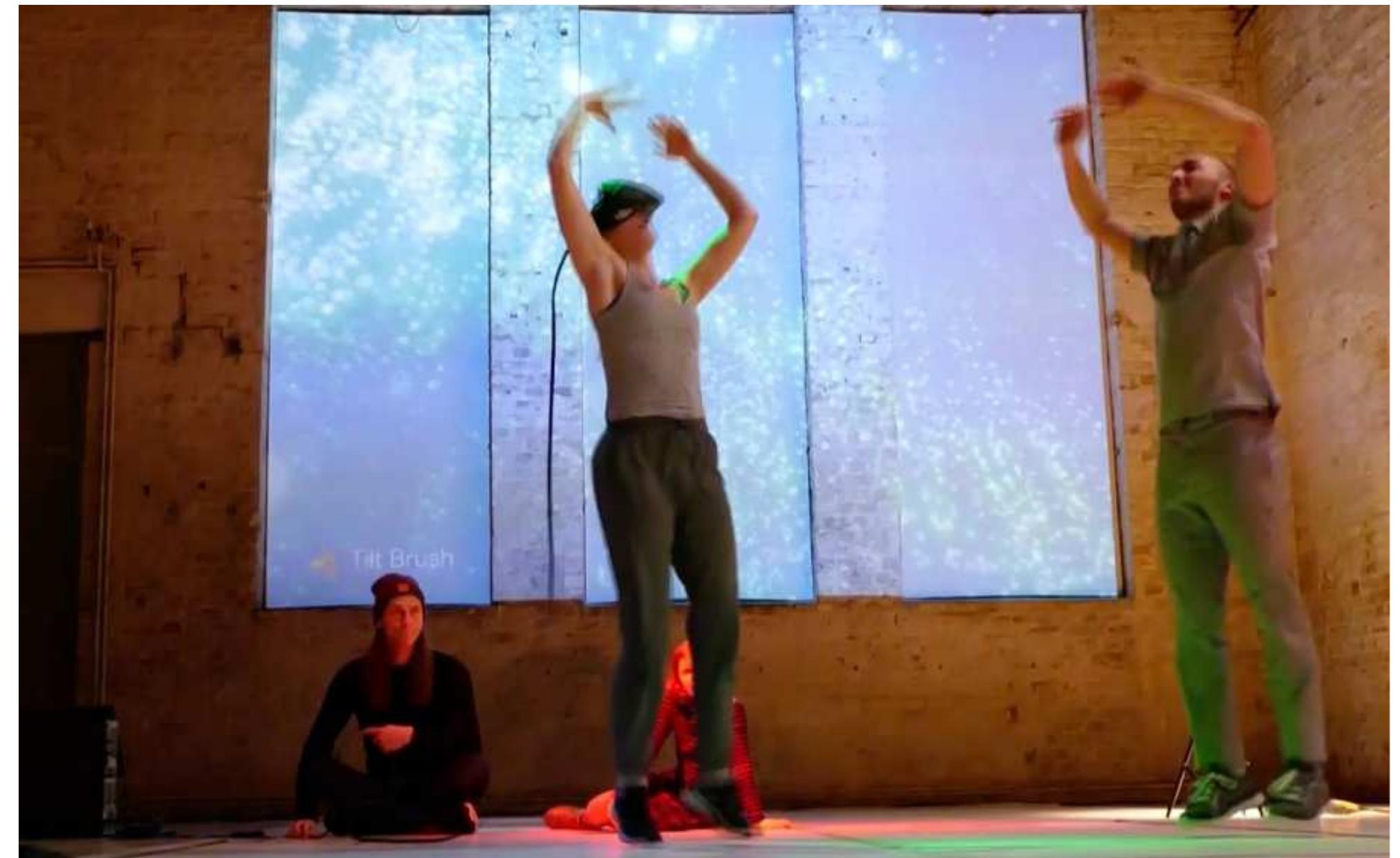 Figure 4. The bubbles metaphor comes into unison in the final scene (photo courtesy: Alexander Katan-Schmid).  RM: To add to that: The bubbles metaphor extended further and enabled our collaboration to integrate experience design, choreographic instruction, virtual world and dancing bodies in the final “Tilt Brush” scene. The metaphor of dancing bubbles generated the visual bubbles in the virtual world. In turn, soap bubbles blown into the actual stage space marked the collapsing borders between the multiple stages of PwVR and opened the performance into the concluding dance party, in which the spectators were invited onstage. The visual metaphors of bubbles turned into a crucial dramaturgica  devise for the performance. 