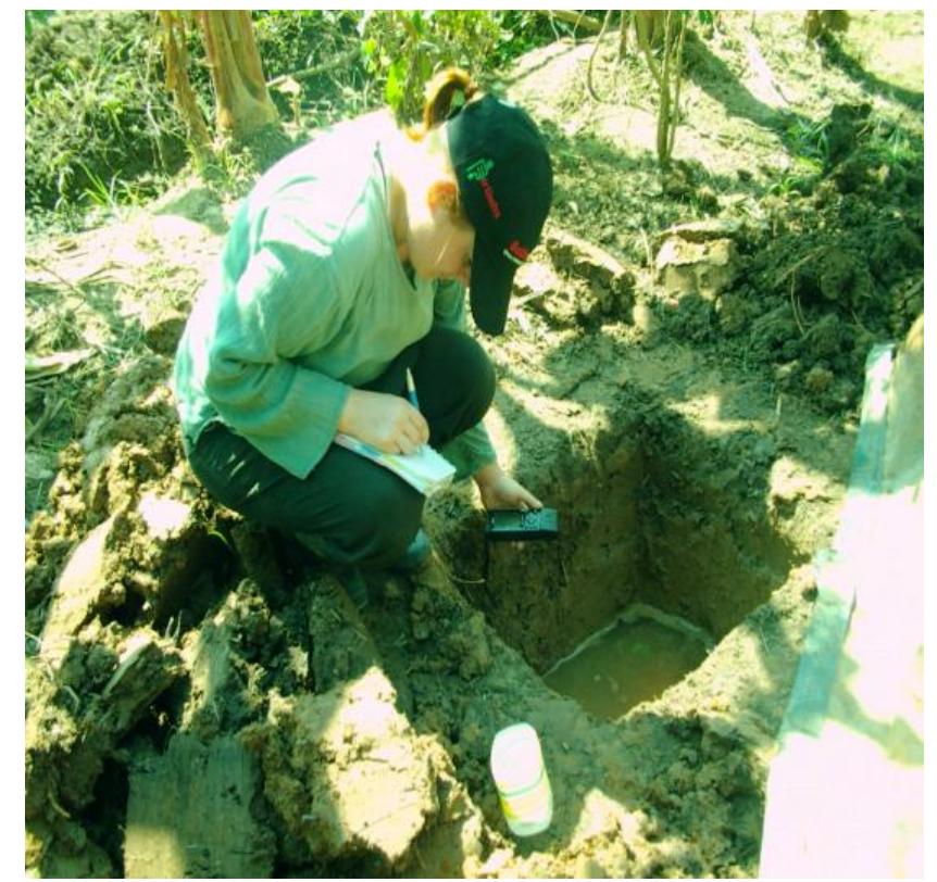 Photo 16. sampling of ground water next to field 1 (gun