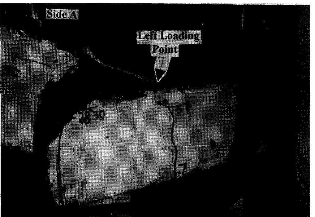 (b)—close-up of the crack at the left end of slab i-150-c