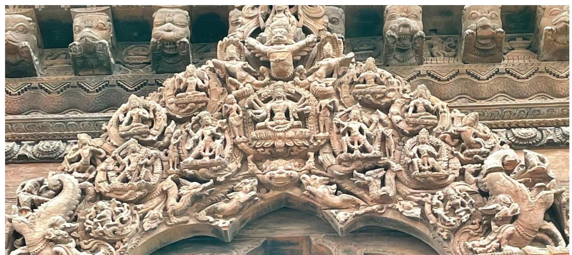 Viripa (lower left) and Luipa (lower right) on a wooden tympanum (torana) on the north side of Vishwanath Temple 