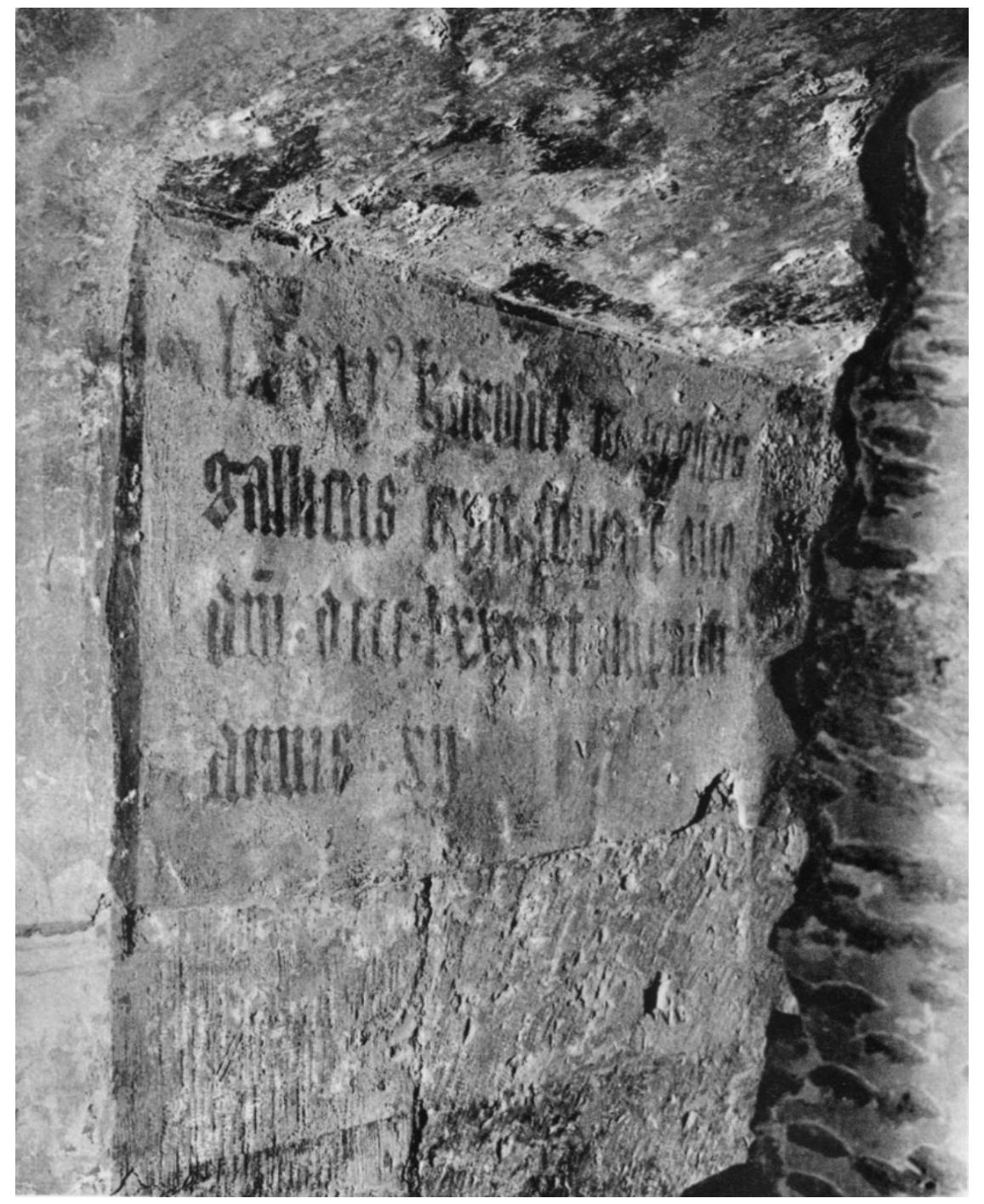 Figure 3. Prague Castle, Vladislav Hall. Fragment of inscription mentioning Charles ITI, from the cycle of emperors. Third quarter of the 14th century. Published by (Borkovsky et al. 1946, unpaged, public domain).  The main decora  tive motif of the Great Hall was an extensive series of panel paintings  depicting Roman and Byzantine emperors along with inscriptions. Two inscriptions have survived, those of Leo IV and Charles III (Figures 3 and 4). The beginning of this cycle was  perhaps captured by  Petrus Apianus in his Inscriptiones Sacrosanctae Vetustatis of 1534,  in which he mentions inscriptions concerning the rulers of four ancient empires known  in the Middle Ages: were followed by the grandfather Henry VI  Nimus, Alexander, Tola, and Romulus (Apian 1534, p. 452). They above-mentioned emperors, and the cycle closed with Charles IV’s , as evidenced by an entry in the Universal Chronicle, which Charles  IV received in 1355 from a burgher from Rimini: “emperors up to him (Henry) are painted  in the royal palace a  Prague Castle” [authors’ translation]. There was probably also a  representation of Charles IV himself, who liked to be depicted in such contexts. We do not know exactly how many paintings made up the whole cycle. Antonin Salaé gave an  estimate of 120 pain Uliény 2018). The set  ings, while Petr Uli¢ny put the number at 104 (Salaé 1962, p. 306; described above was accompanied by decorative painting found in  the great hall and also in the chapel. Their description by Dobroslava Menclova and Vaclav  Mencl reads: “The ed decorated with illusio  ge of the niche and the edges of the side walls of the windows were nistically painted architectural profiles in brown-red, with white and  red bands, which in the middle part of the lining turn into brown bands; the background of the window was black, with French lilies and palmettes alternating. The lower part was then conceived as a carpet, with a pattern of alternating brown pomegranates and  cobalt blue scorpions  against a purple-red background” [authors’ translation] (Menclova  and Mencl 1947, p. 272; Zaruba 2015, p. 149). The transferred parts rediscovered in the storehouses of Prague Castle confirm the veracity of this description (Figure 5). 
