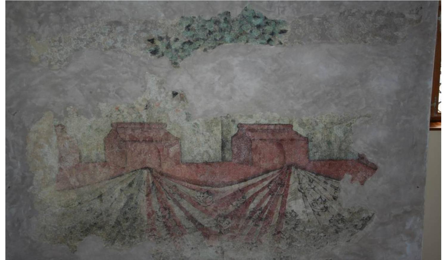Figure 9. Loket, the first floor of the palace of Wenceslas IV, today called the Governor’s House, probably the end of the 14th century. Photo by FrantiSek Zaruba, the author’s own work.  The only well-preserved decorations that we can—a  beit cautiously—associate with  Wenceslas IV are at Loket Castle. The paintings there were discovered on the first floor of the palace built by this king. Their lower strip shows walls topped with battlements, to  which a curtain decorated with stenciled patterns is attac  hed (Figure 9). Above the walls  are a colorful garden with a flowering meadow and spreading trees in which colorful birds  are perched. In the 15th century these paintings were su and figural scenes.  pplemented with coats of arms 