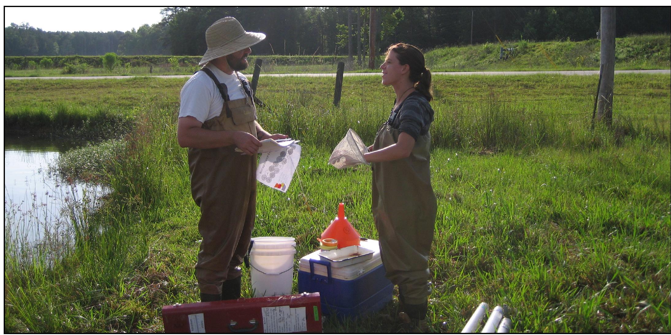 Dr. Alan Wilson (left) and Rachel Zitomer (right) set up a field experiment to see how the amount of nutrient fertilizer influenced the effect of fish consumers on phytoplankton primary producers. 