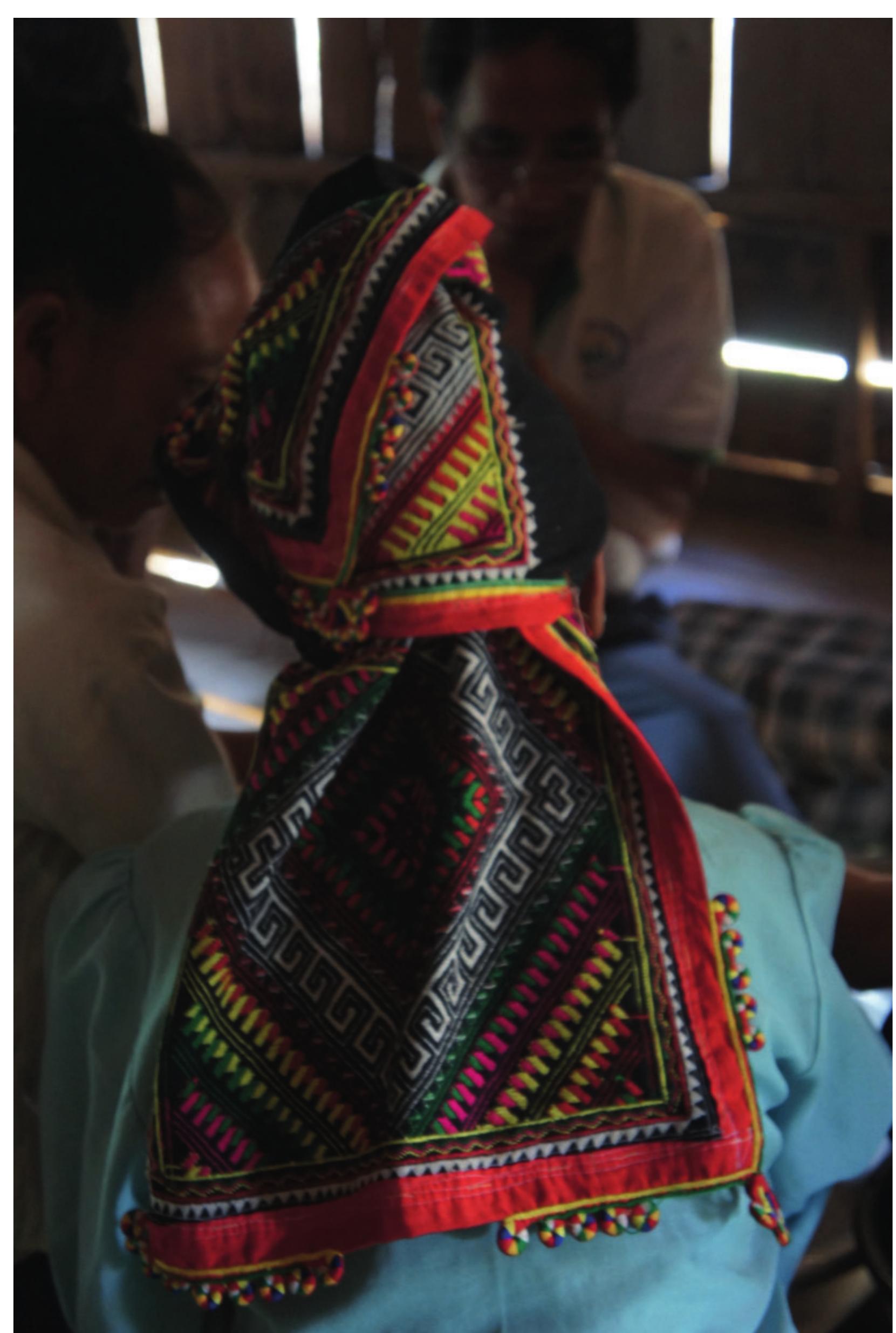Figure 3. Ksingmul women wear a turban (loop khat ?luu) that shows influence from the Tai Dam. 