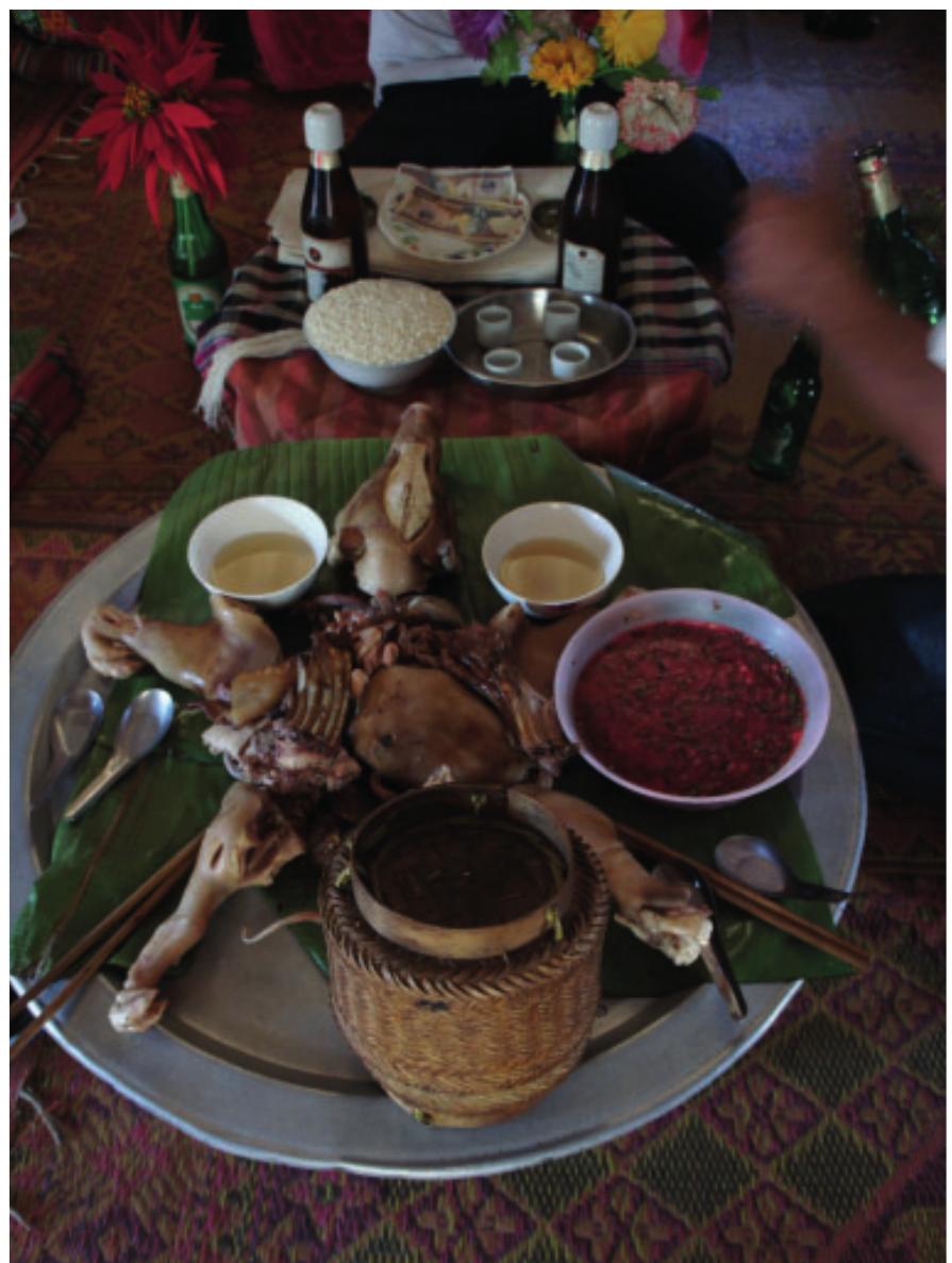 Figure 4. Ritual offering to the household spirits (skil jiay) in a Ksingmul house, maintaining reciprocal relations between sk#/ and ksiin within the domestic sphere. 