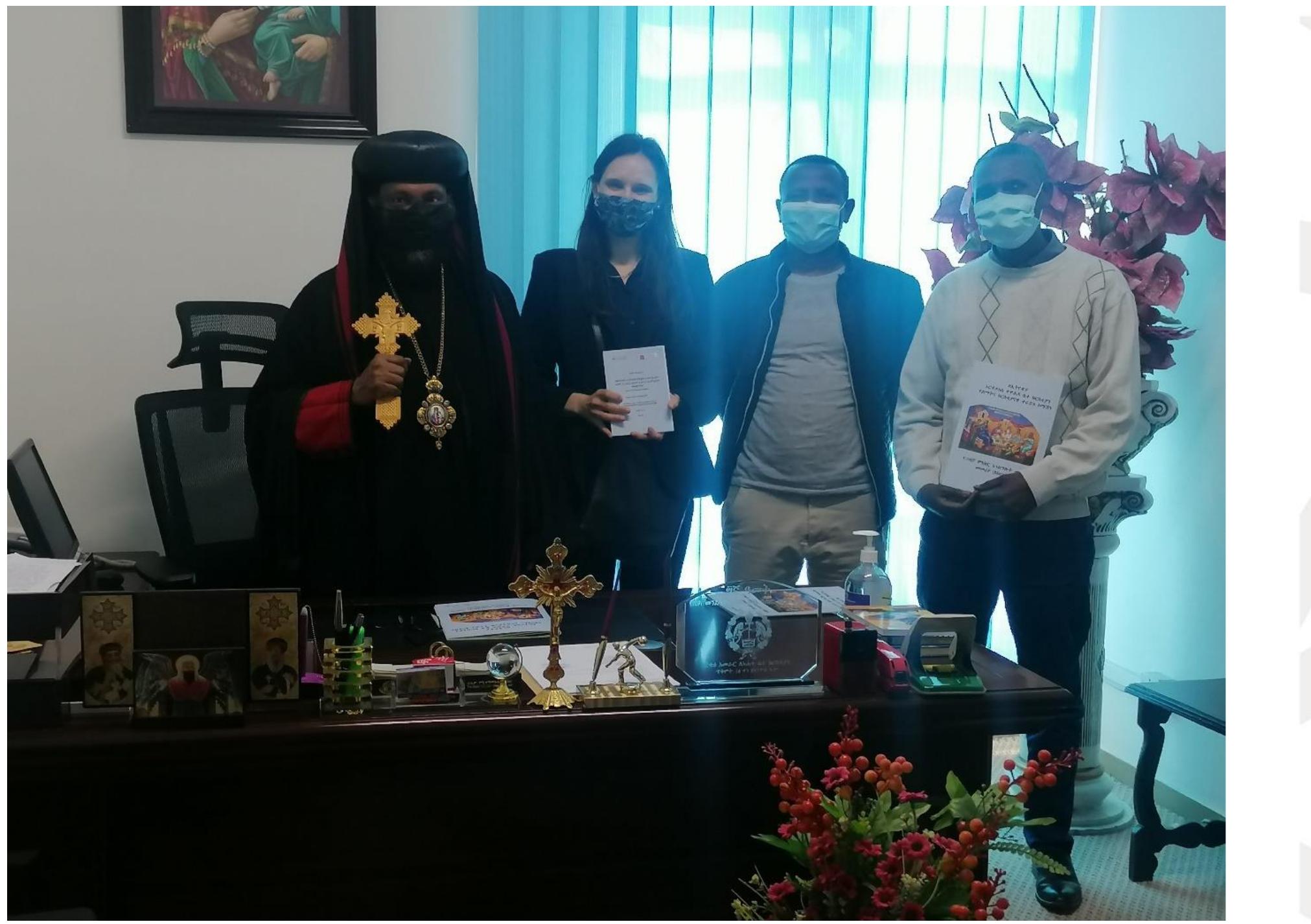 Photo 2: Dr Romina Istratii with EOTC DICAC colleagues and Bishop Samuel at the officers of th partner organisation 