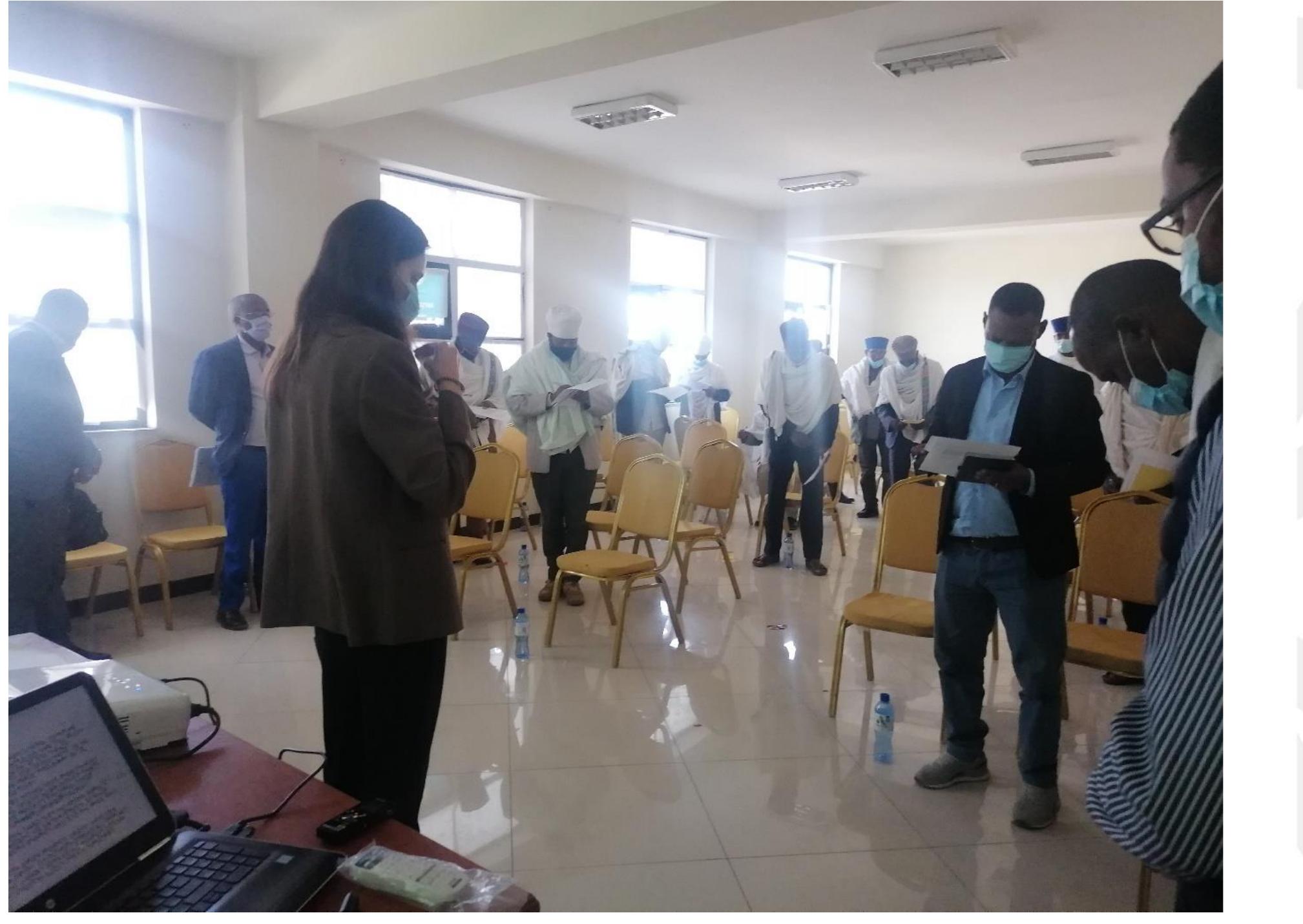 Photo 4: Starting the workshop with obtaining participants’ written consent, followed by a prayel led by a clergy participant  conceptualised to serve two aims: firstly, to respond to the clergy’s feedback and the evidence in the international literature that clergy need continuous training to assimilate the training material and continuous support to respond to new questions and issues; secondly, to serve as a post- workshop assessment method in lieu of the written report cards that had been intended to serve this purpose. 