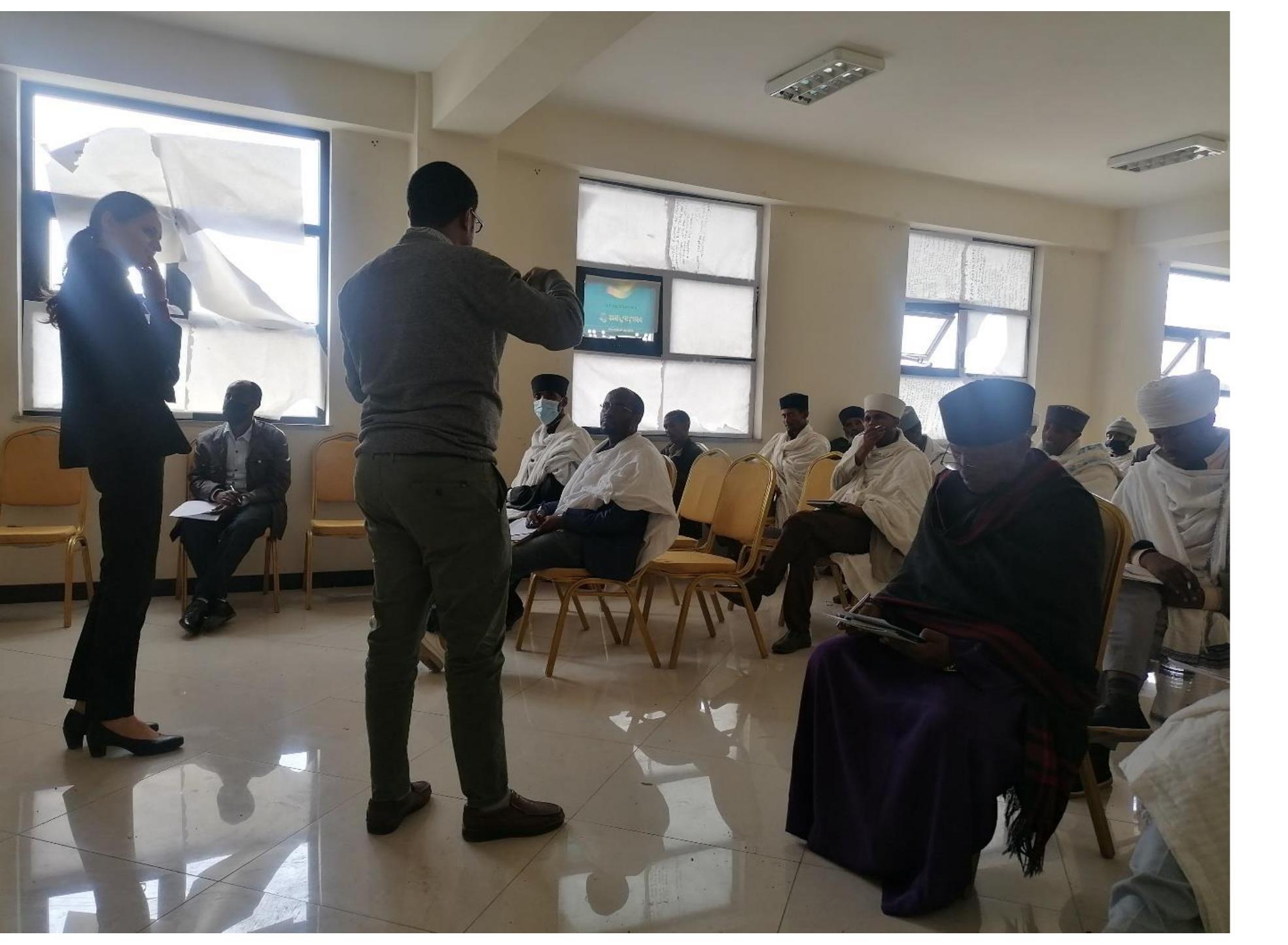 Photo 7: Trainer Mr Henok Hailu, deacon and practising psychologist explicating Church teaching  The presentation was followed by a group activity (see Appendix 4) which asked participants to consider teachings and discourses of clergy as collected in the field and to discuss how these could be improved or clarified theologically on the basis of the training they were given. Participants were each handed a form that listed the examples and were asked to discuss among themselves and to reach an agreement on whether these teachings and discourses could be improved and how. They then presented their thoughts to the rest of the attendees. 
