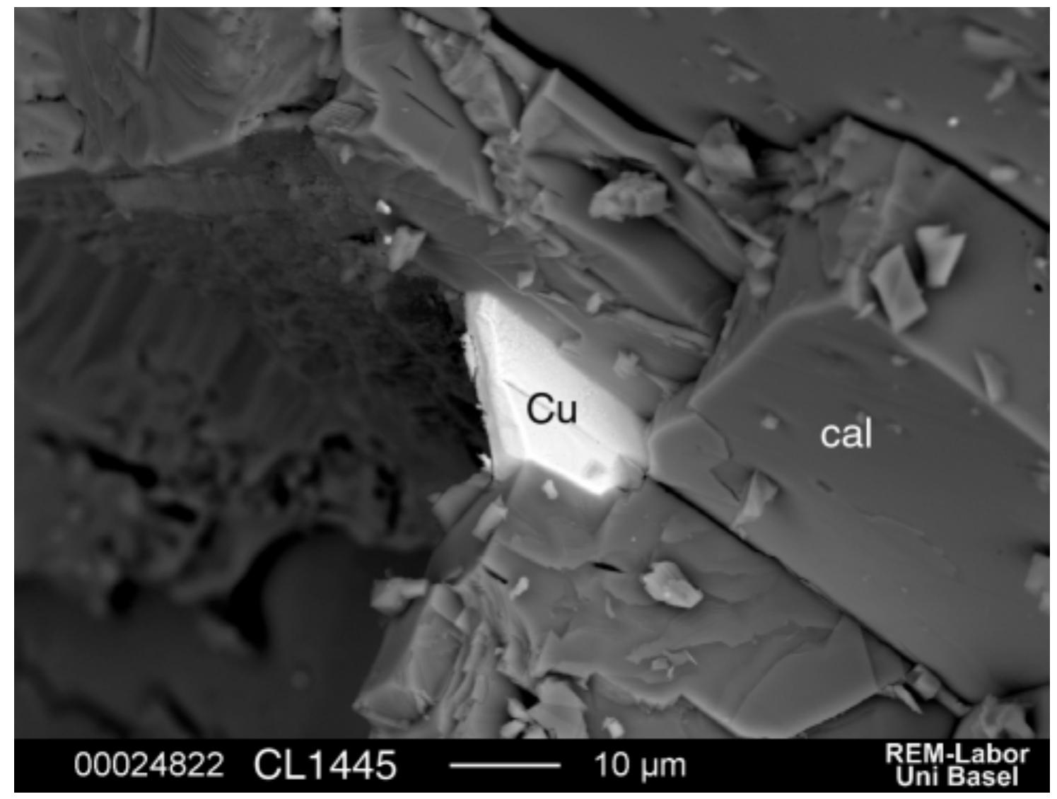 Native copper sheet on the cleavage of calcite.