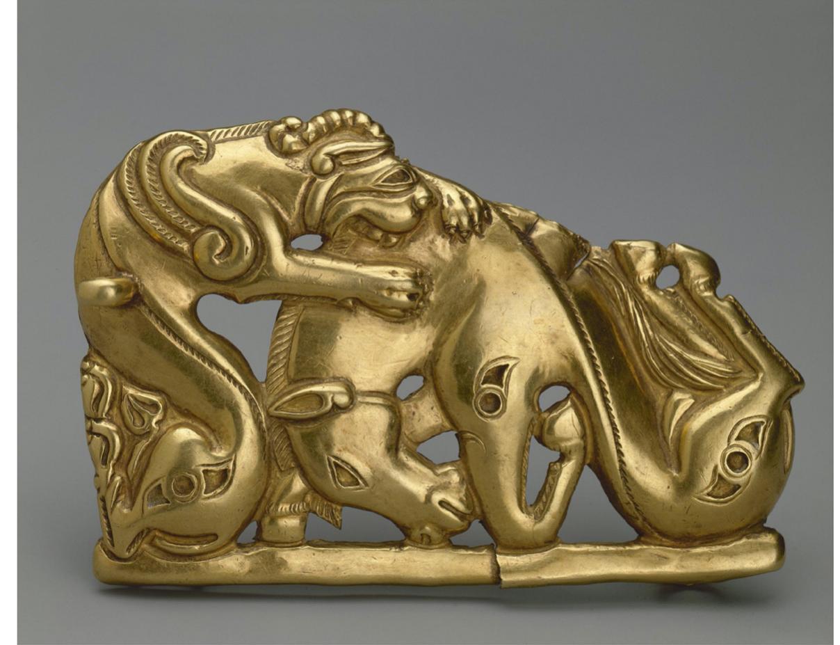 Figure 1. Animal combat scene. Belt buckle. Gold, hammered and soldered, inlay Fourth to third century B.c.£., Siberian collection of Peter the Great (likely from Soutt Siberia).  Source: The State Hermitage Museum, St. Petersburg, Russia 